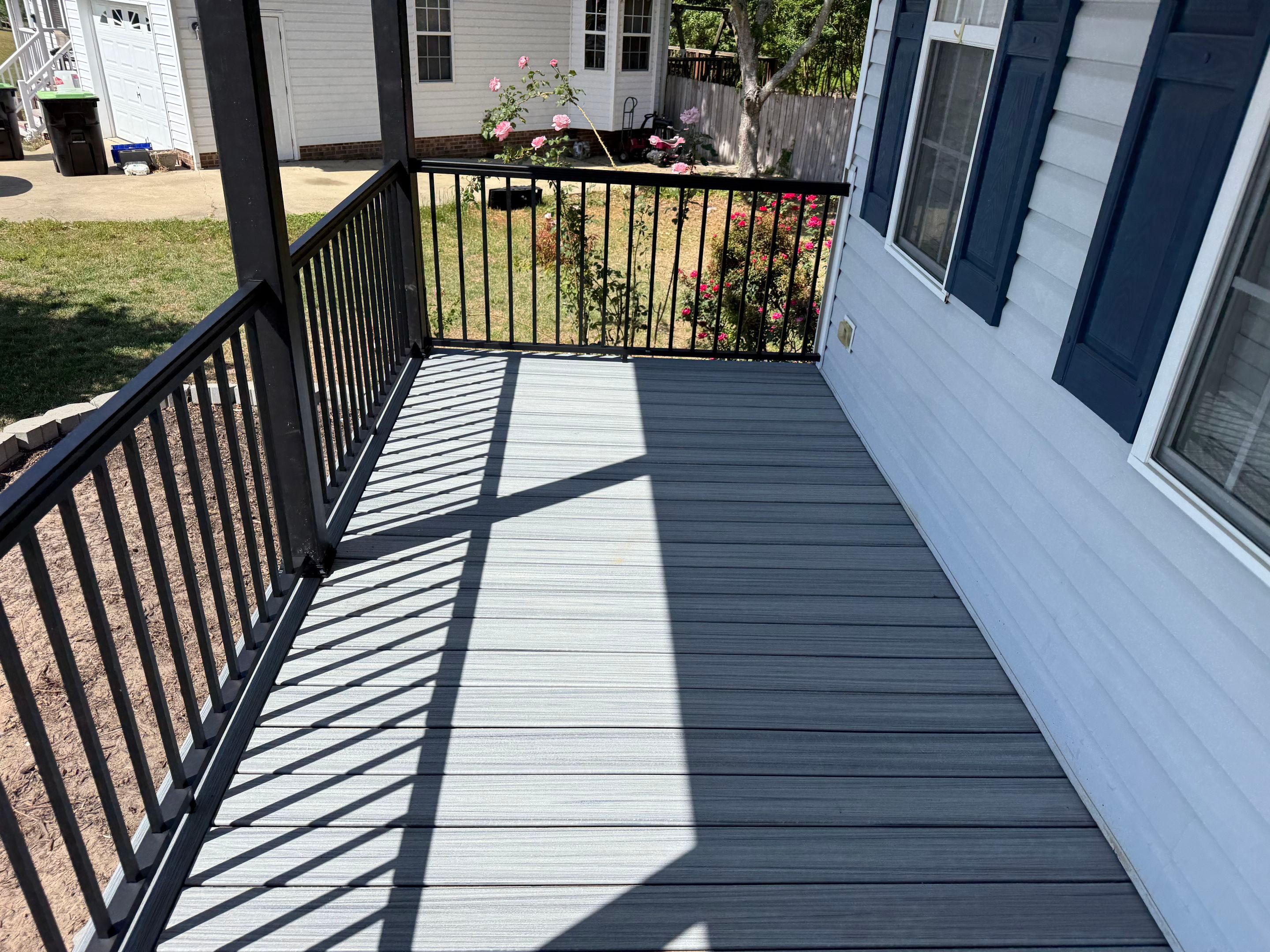 Willow Spring Composite Deck Resurface and Black Railing Upgrade by The Remodeling Company