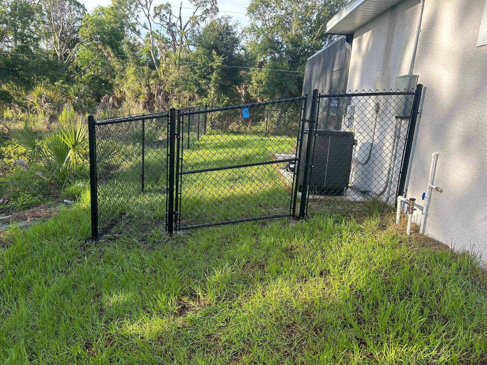 Residential Black Vinyl-Coated Chain Link Fence in Port Charlotte by True Fence LLC