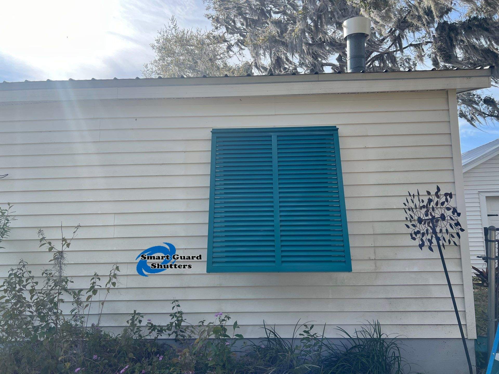 Bahama Shutters in Water Blue by Smart Guard Shutters