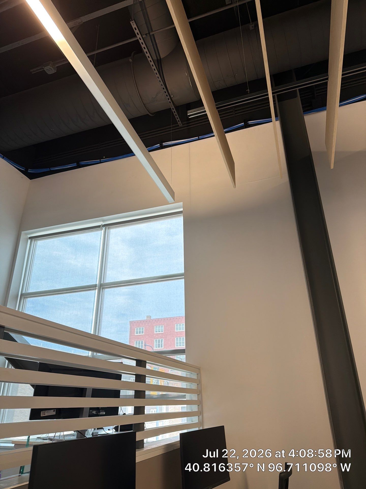 Lincoln Commercial Office Remodel with Glass Doors and Acoustic Baffles by CompanyCam Sales Demo