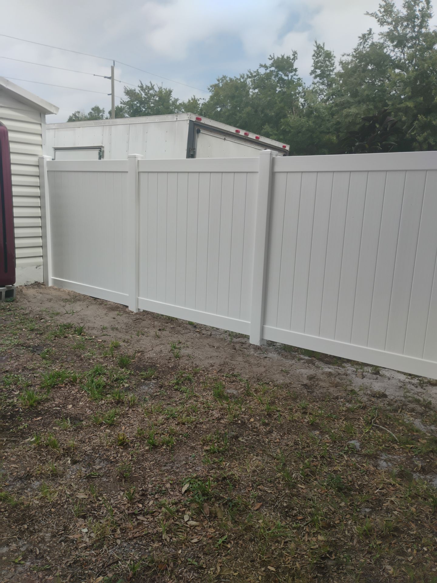 White Vinyl Privacy Fence Installation and Gate Assembly in Punta Gorda by True Fence LLC