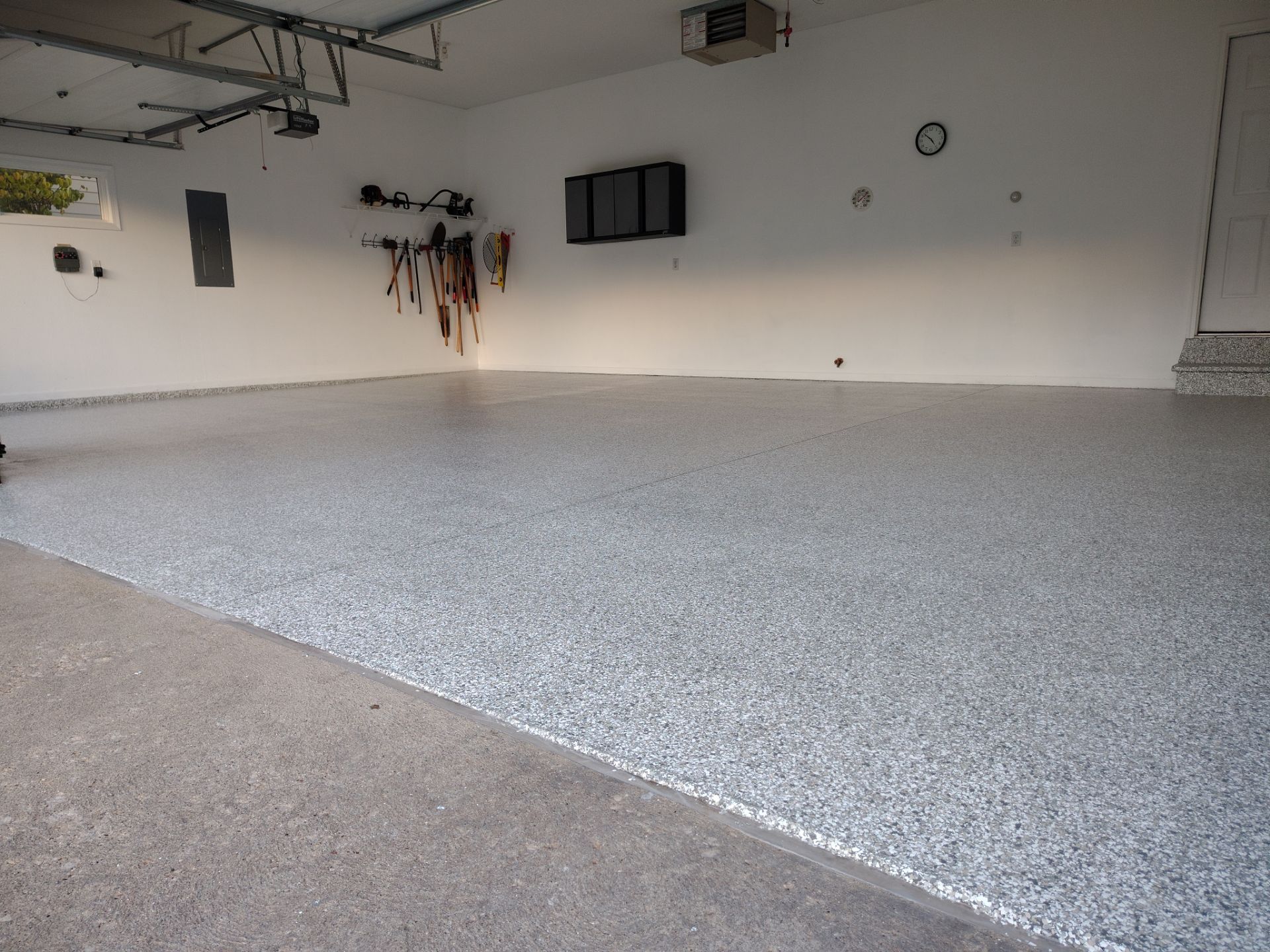 New Johnston Garage Resurfacing by Revival Concrete Coatings, LLC