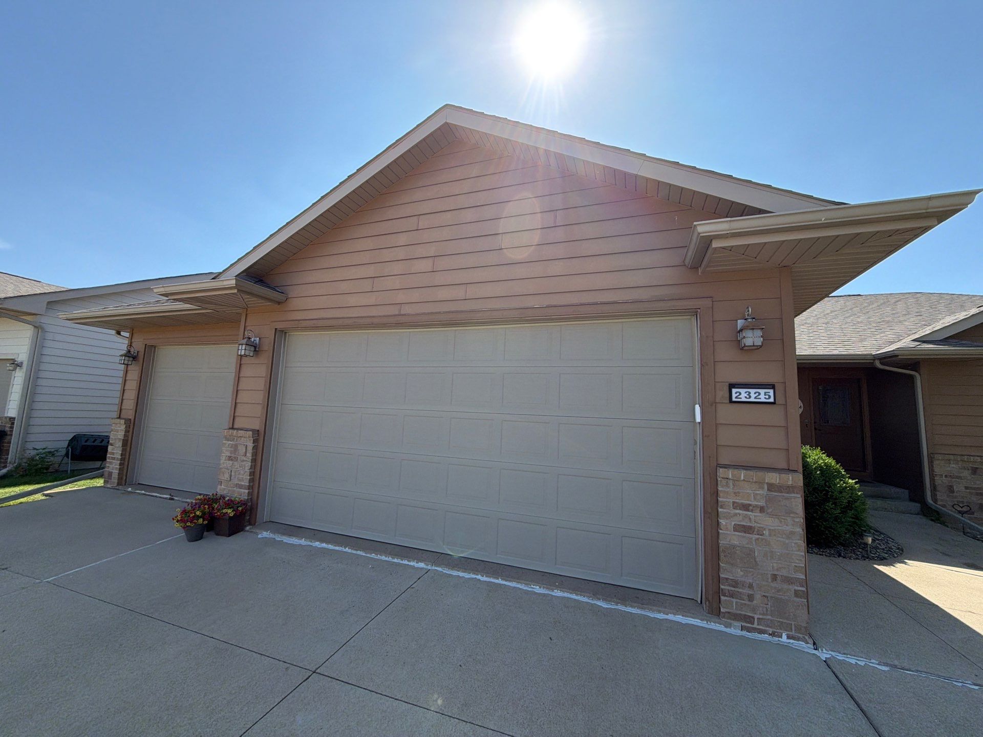 Full Exterior Residential Painting and Siding Refresh in Tea by Select Painting, Coatings & Garage Cabinets
