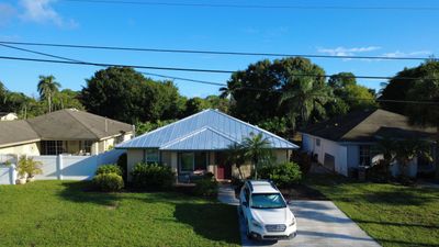 Residential Roofing Installation using 1" Nail strip metal roof