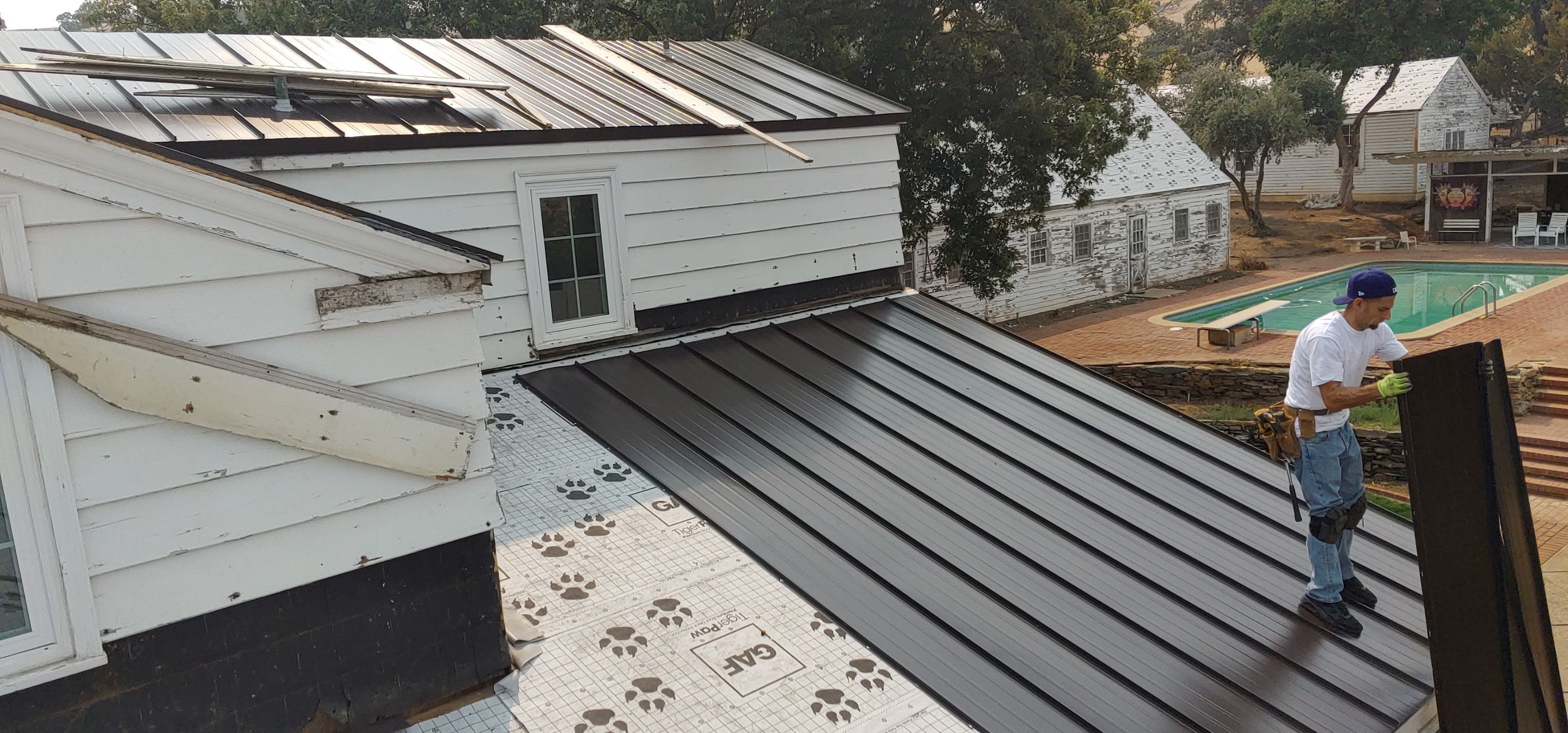 Residential Roofing Installation using Standing seam metal roofing system by Straight Edge Roofing Inc