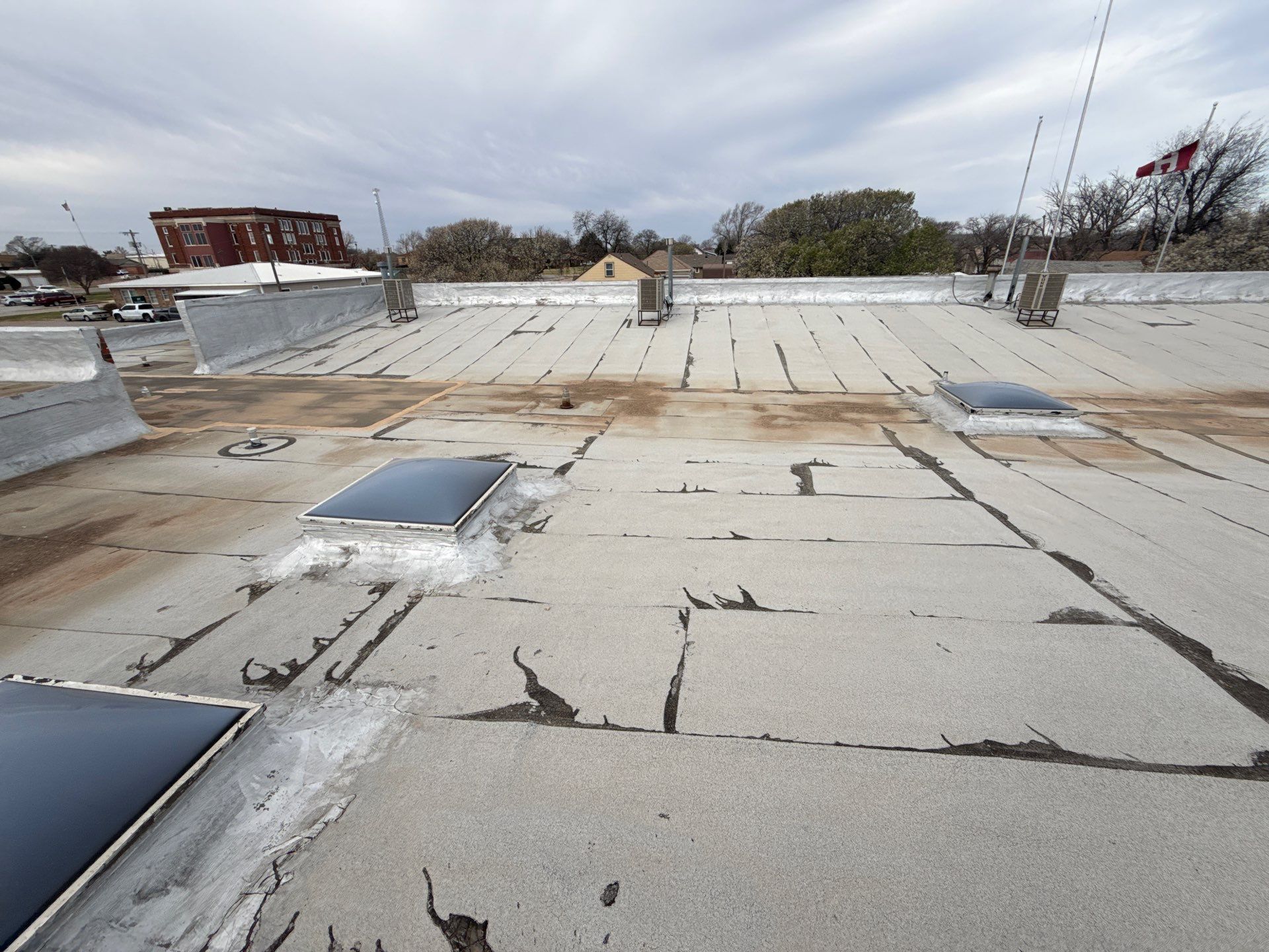Hollis High School Comprehensive TPO Roof Replacement and Restoration by Secondary Rhodes
