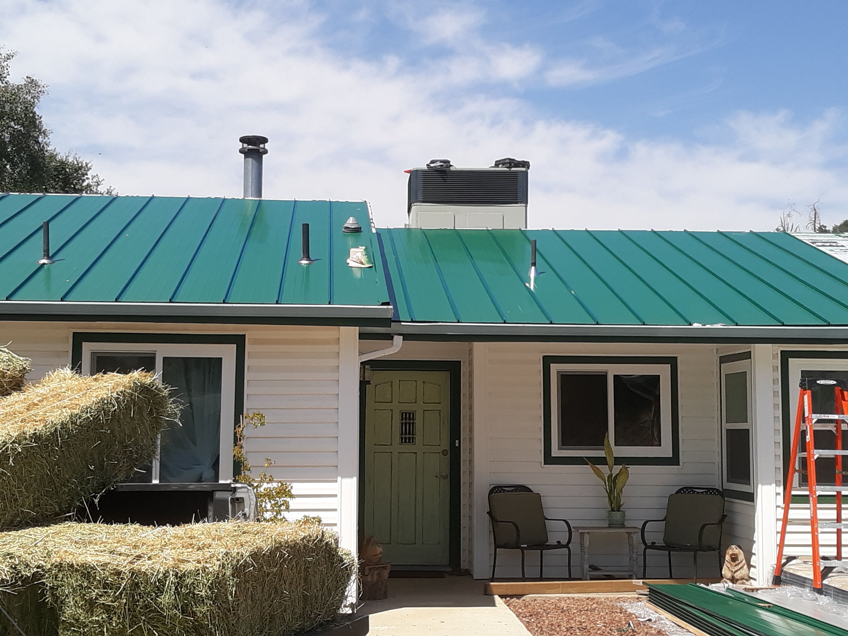 Metal roofing installation using Standing seam metal roofing system by Straight Edge Roofing Inc