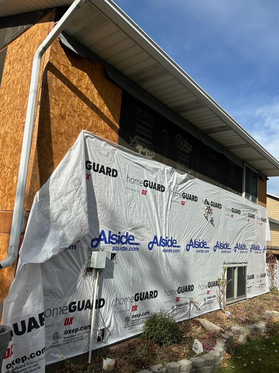 Aluminum Siding Replacement with Blue Dutch Lap Vinyl Siding and White Trim by ASAP Roofing & Restoration