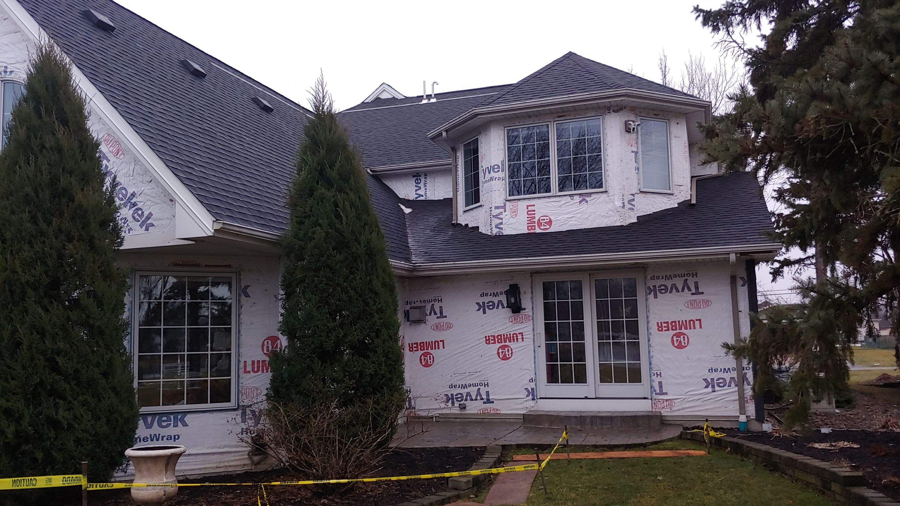 Exterior Renovations- Siding, Concrete, Railings, and Entry Door  by Ivy Lea Construction