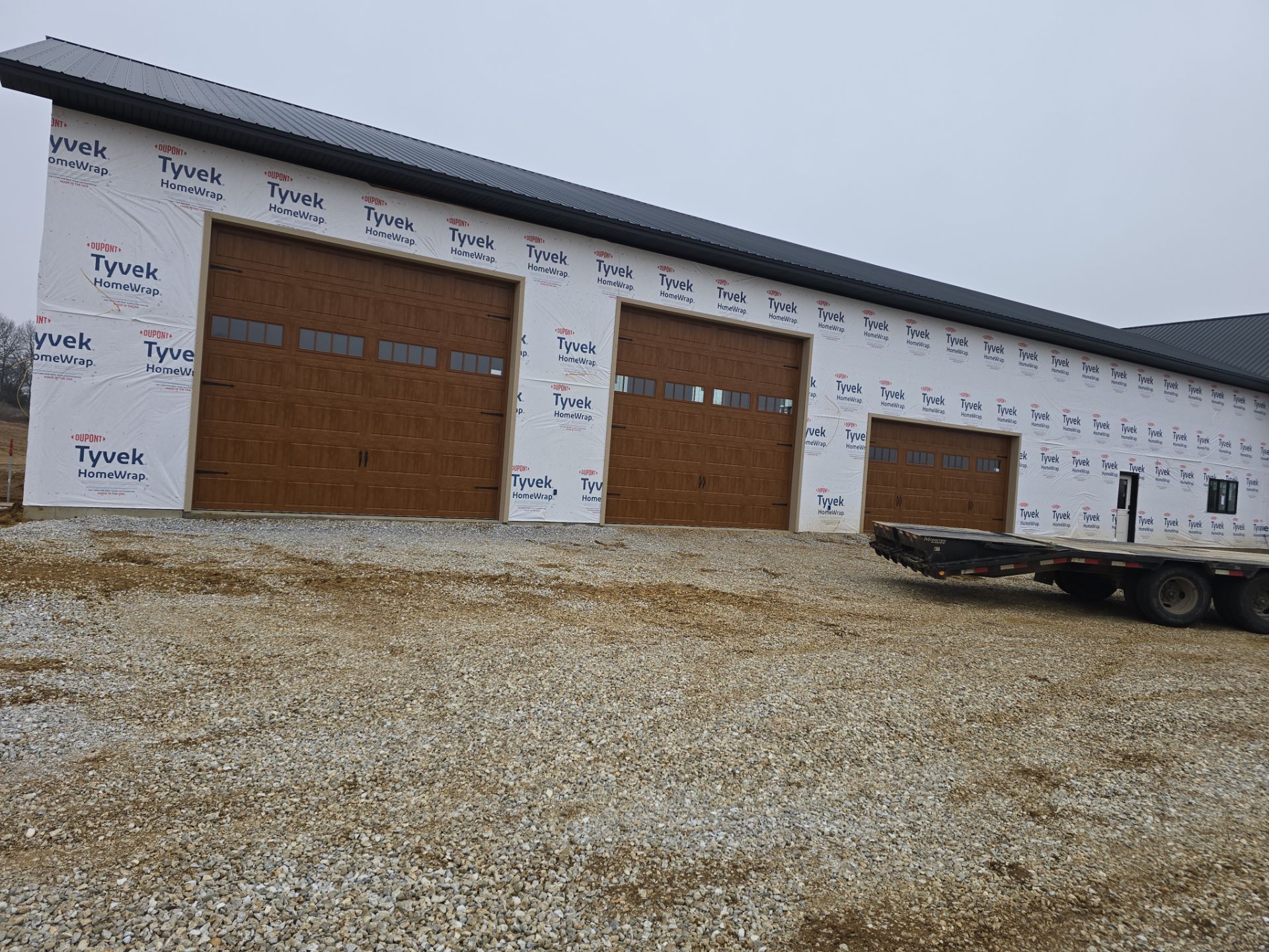 New Home construction w/ board and batten sides and metal roof  by Miles Construction 