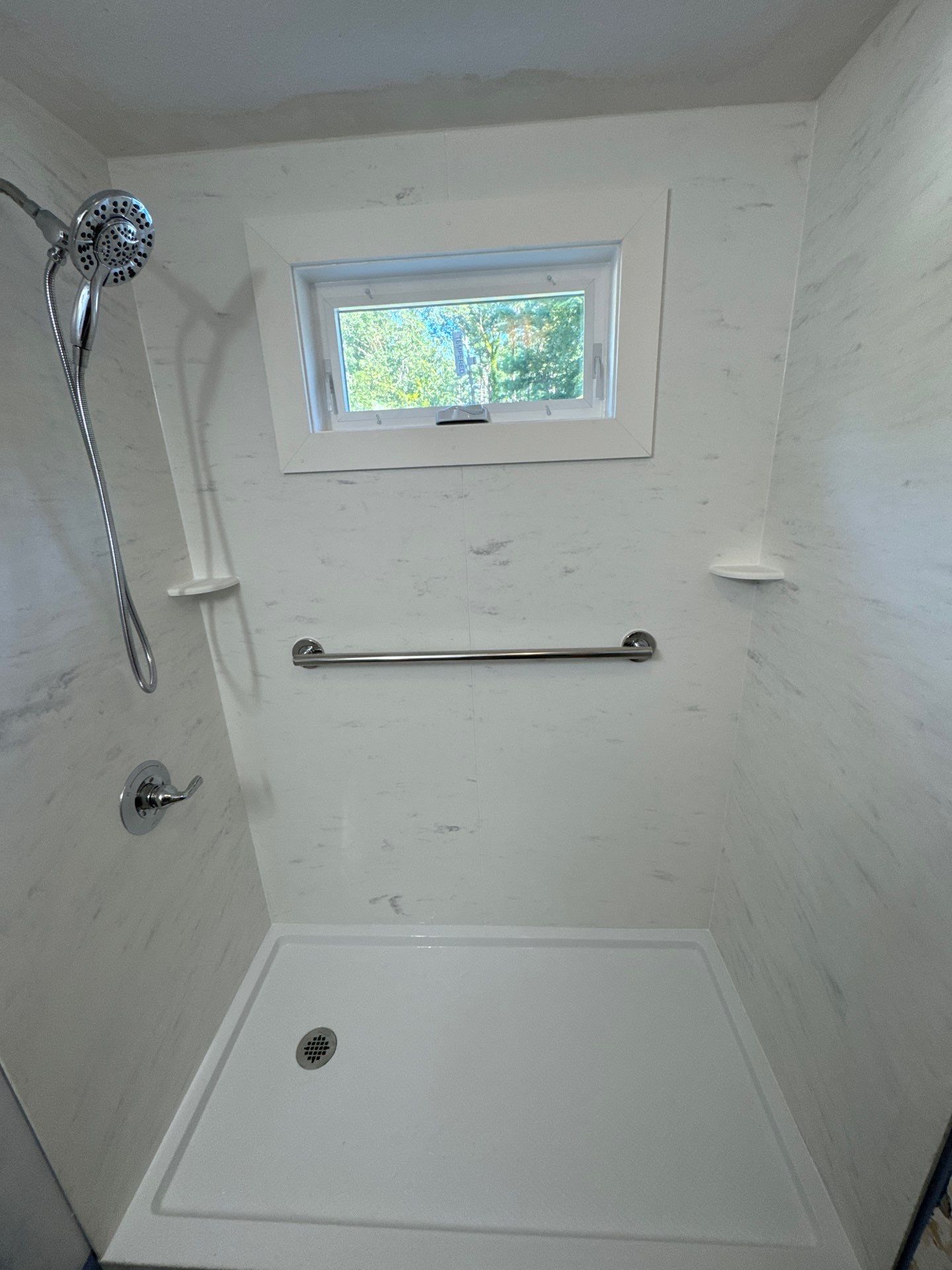 Tub-to-Shower Conversion using Swanstone Carrara by Chagnon Building & Remodeling LLC
