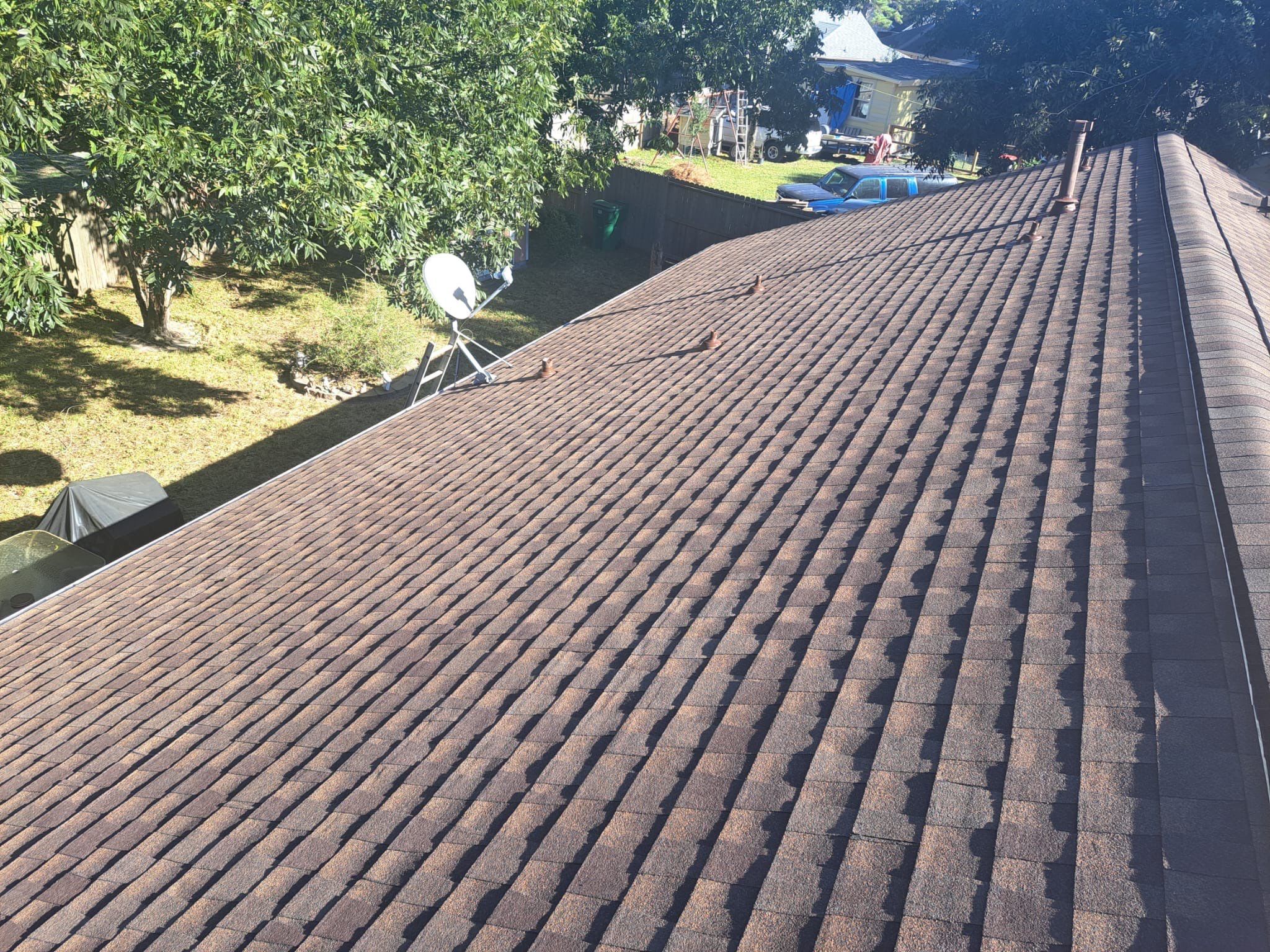 Hail-Marked Roof Replaced in Warm Brown — Houston, TX by PL Roofing & SB Roofing, LLC.