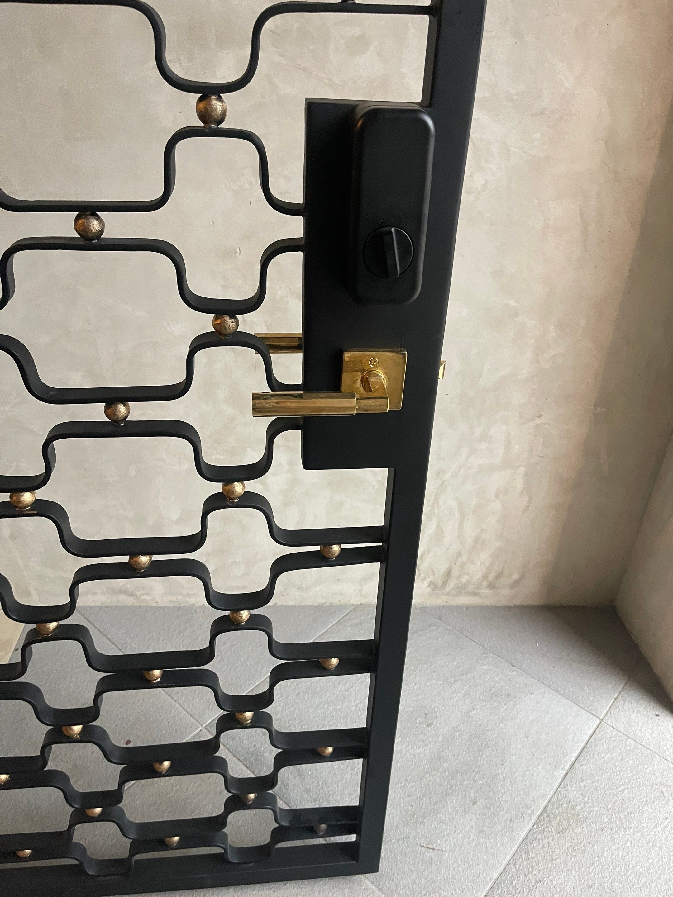 Arched Decorative Metal Security Gate Installation in Dallas by Solara Custom Living