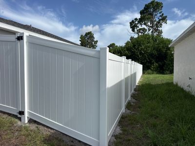 White Vinyl Privacy Fence and Gate Installation in Port Charlotte