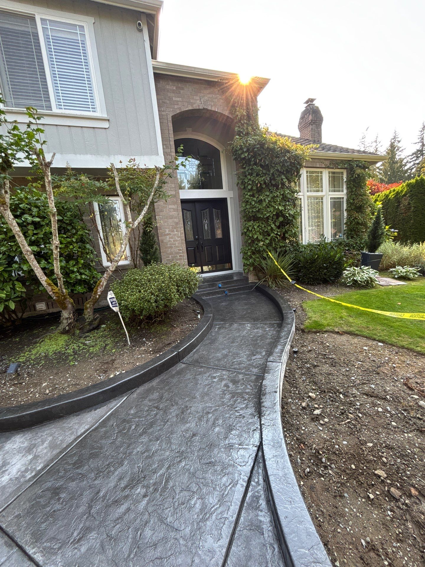 Multi-color Stamped & Sealed Concrete Driveway Renovation | Mukilteo by Jireh Asphalt & Concrete Inc