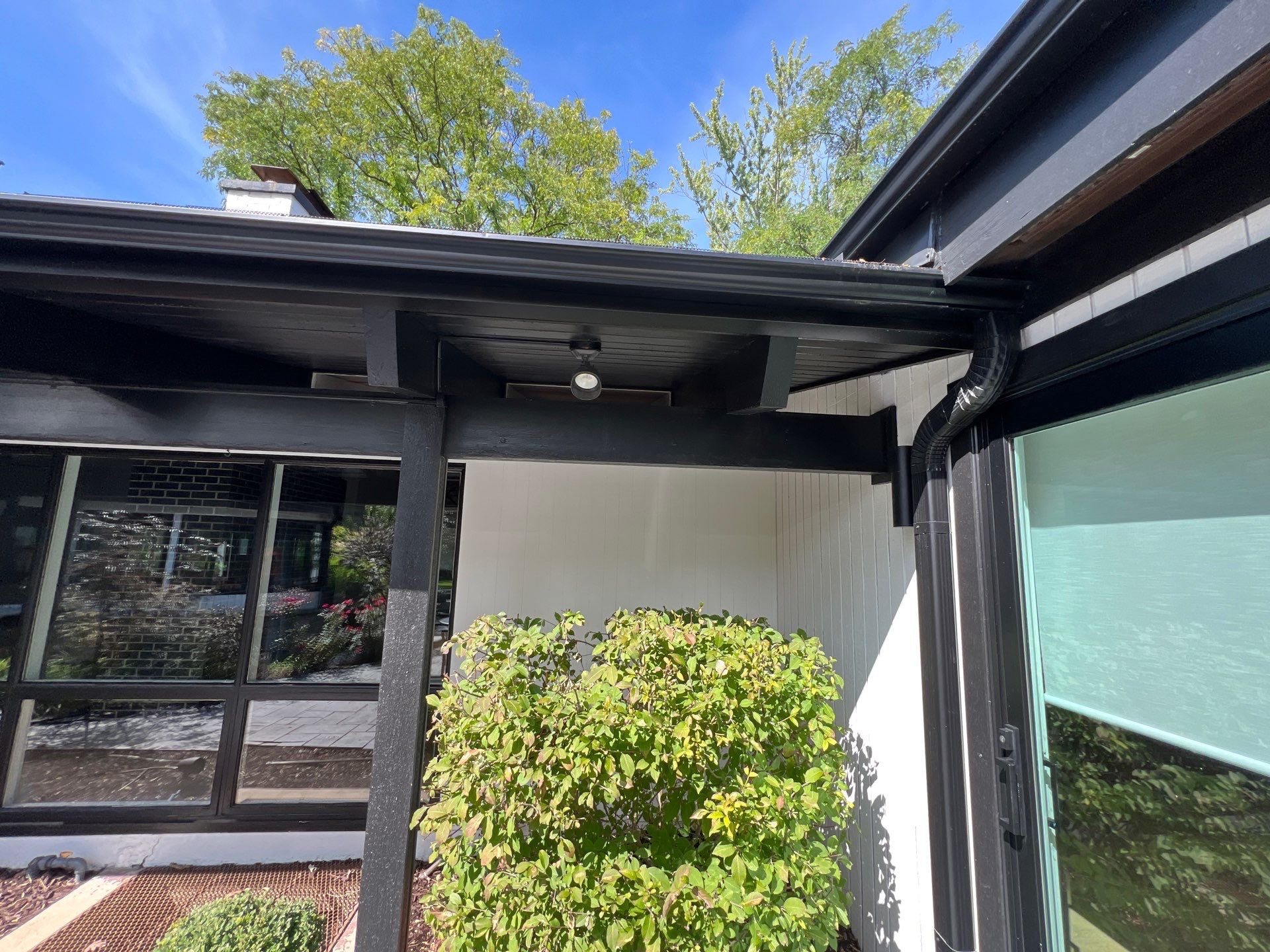 Complete Exterior House, Bluestone & Garage Floor Cleaning by Northern Power Washing LLC.