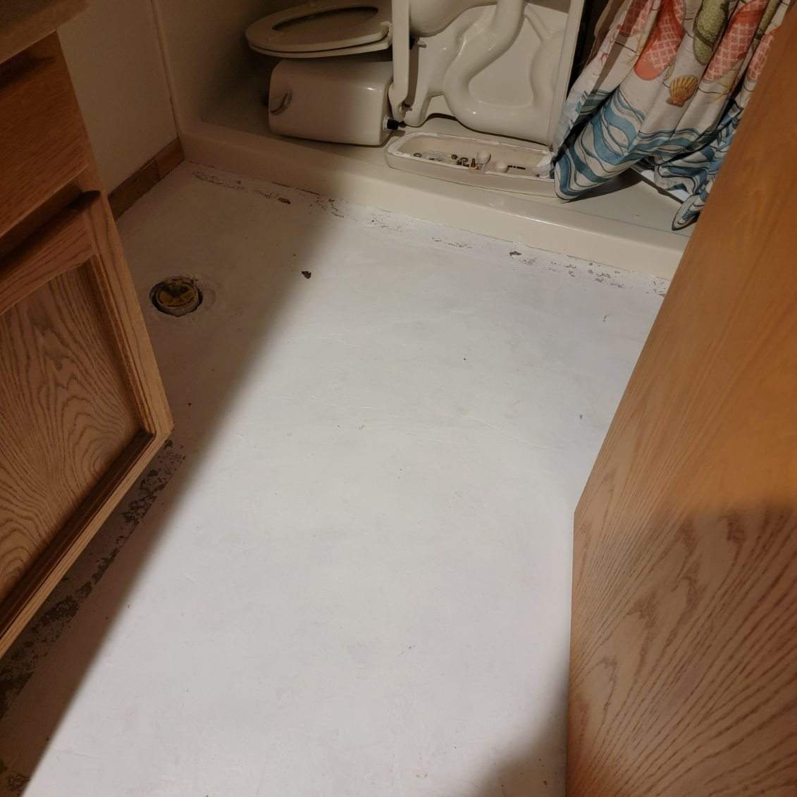 Full Garage and Basement Epoxy Floor Coating in Winner by Select Painting, Coatings & Garage Cabinets