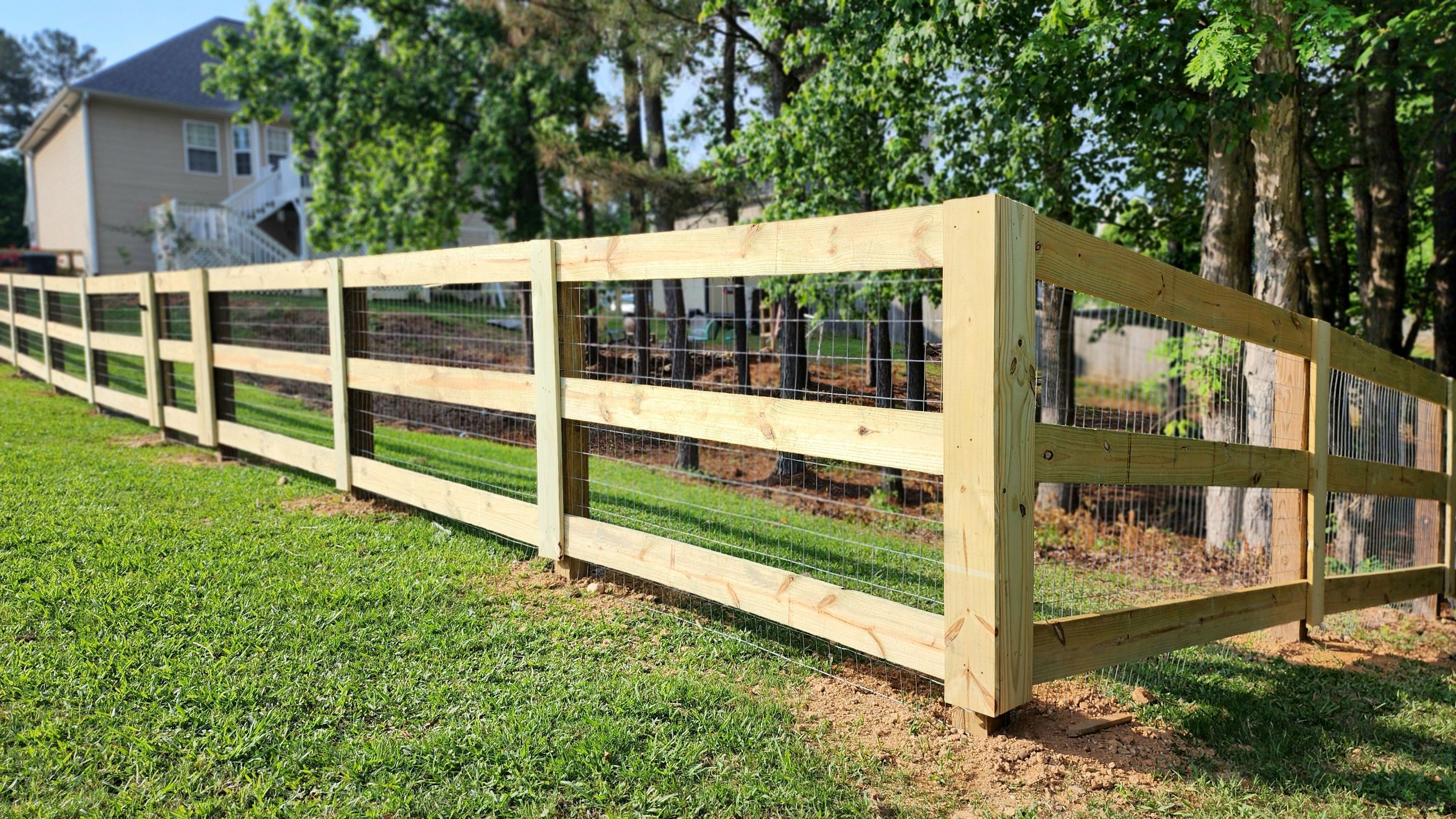 Fence Installation of 3 Rail Ranch with Wire Backing by Titans of Timber Fence & Stain