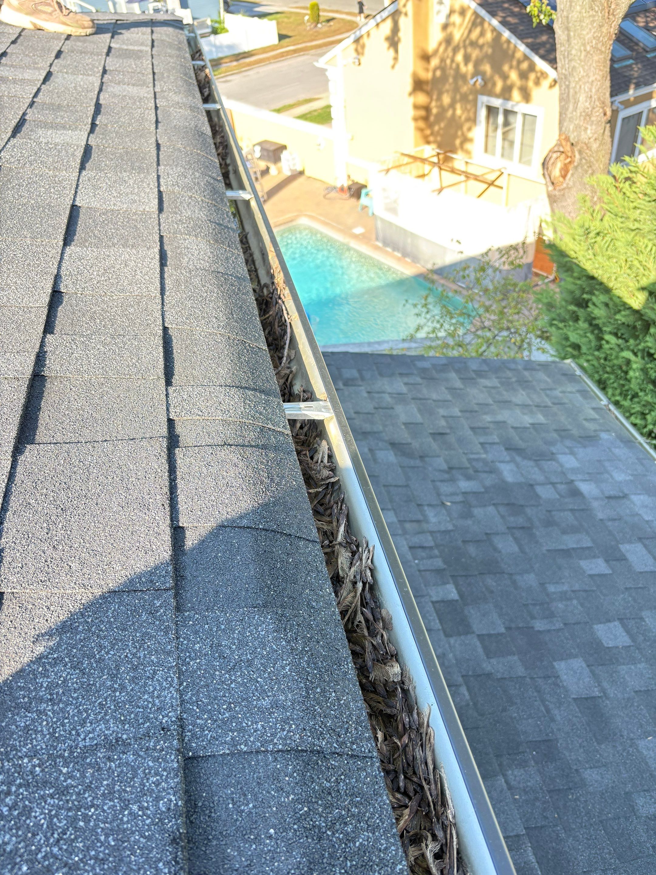 Gutter Cleaning N Woodmere by Above All Gutters