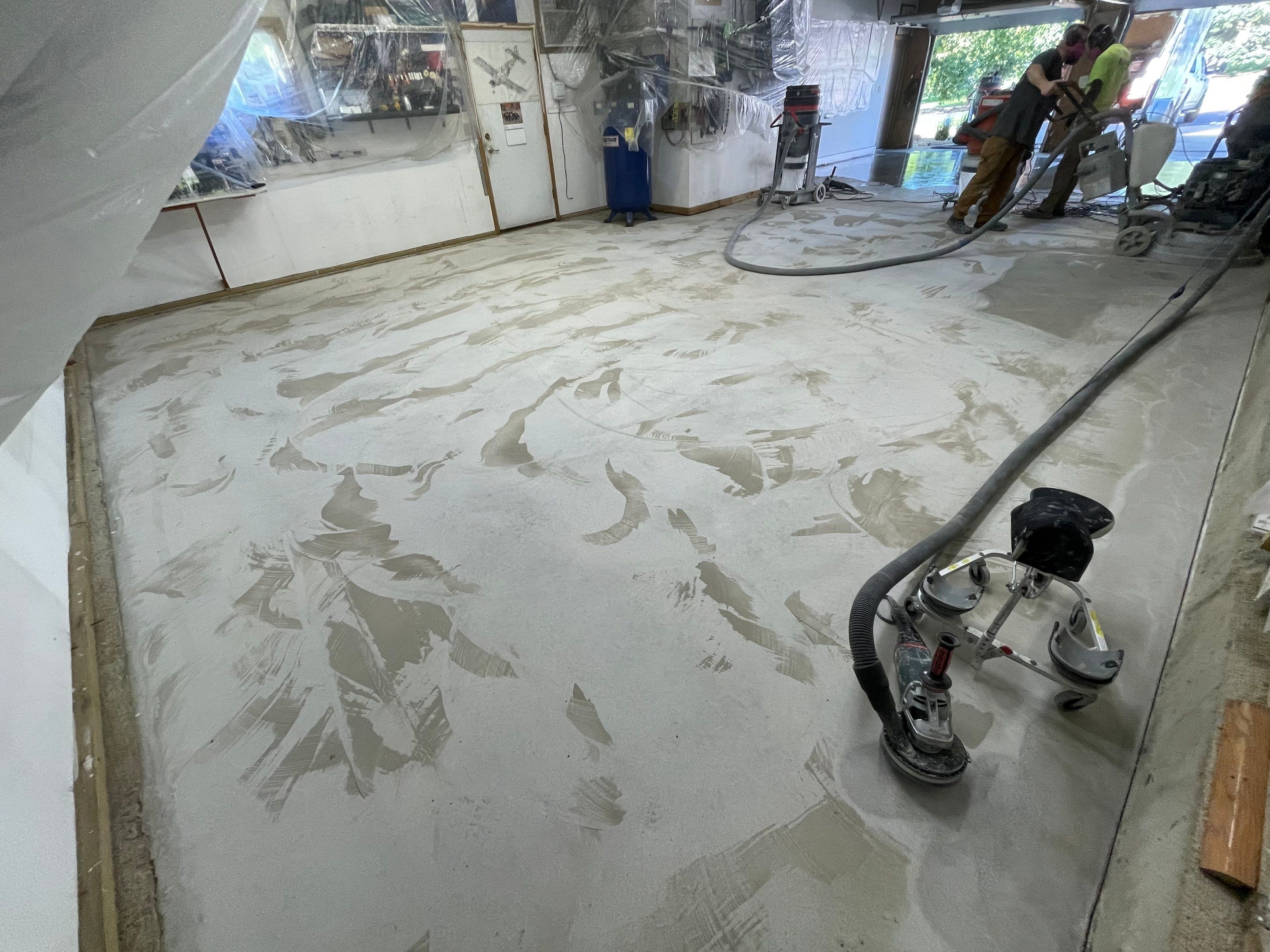 High-Performance Polyurea Garage Floor Coating and Stem Wall Finishing in Sioux Falls by Select Painting, Coatings & Garage Cabinets