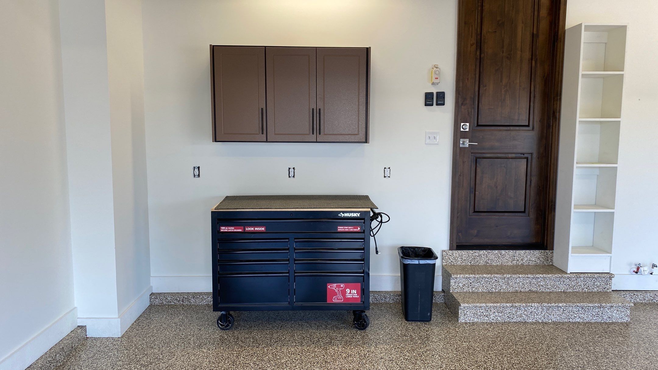 Kenny & Debbie transformed their garage with a Banner Garage Floor and cabinets by Banner Garage