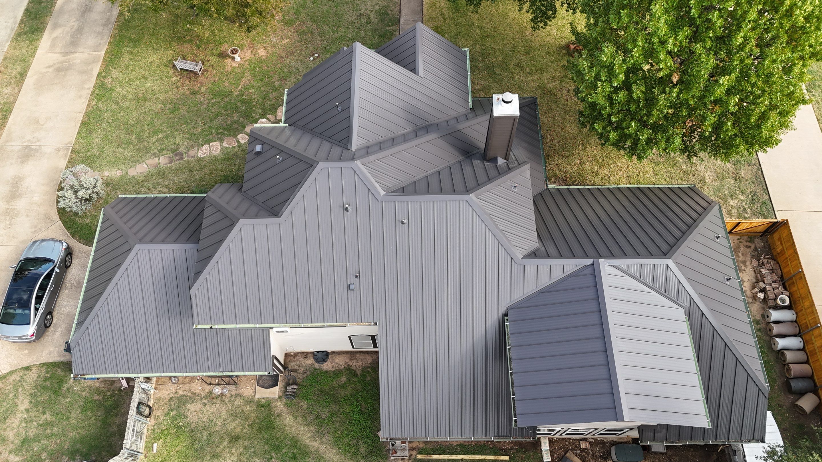 Residential Roof Replacement using 24 GA Double-Lock - Matte Black by Action Exteriors Austin
