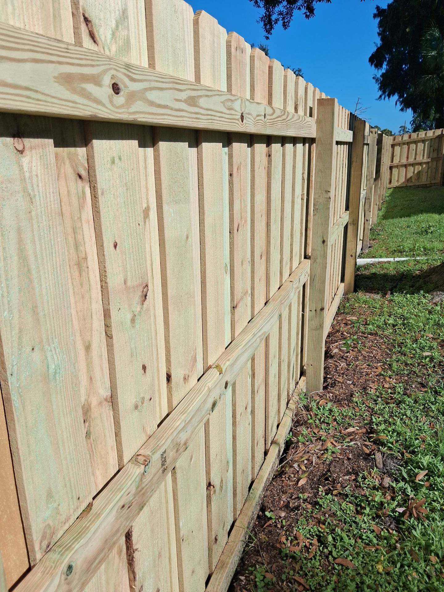 Wood Privacy Fence Installation with Double Gate in Port Charlotte by True Fence LLC