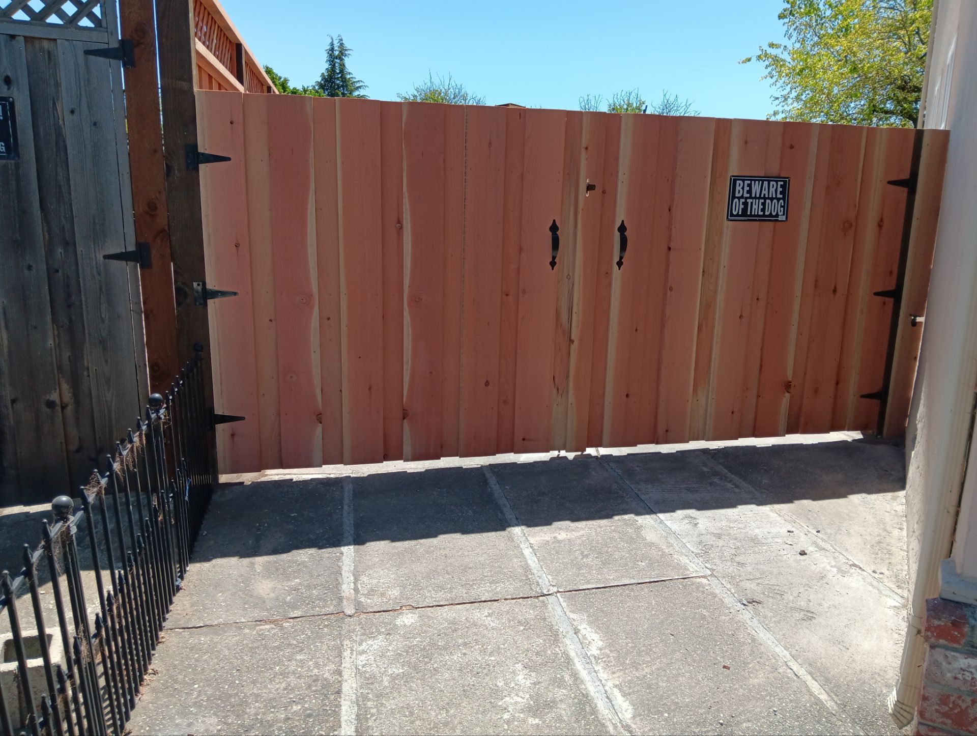 Board on Board with 1' Triple Lattice - 8' / 6' High by Fremont Fence Inc