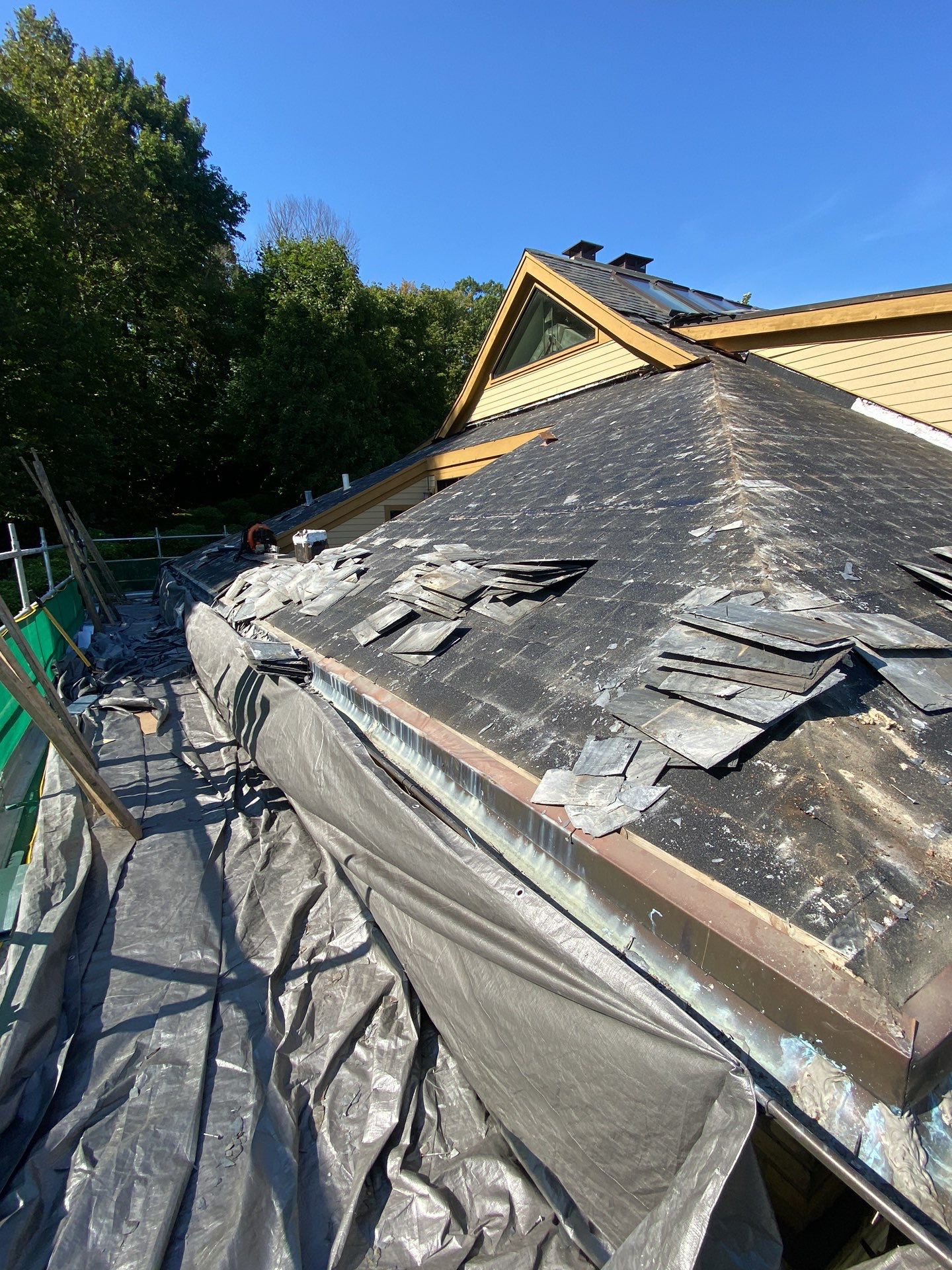 Slate Roof Replacement and Half Round Copper Gutter Installation by Custom Installations