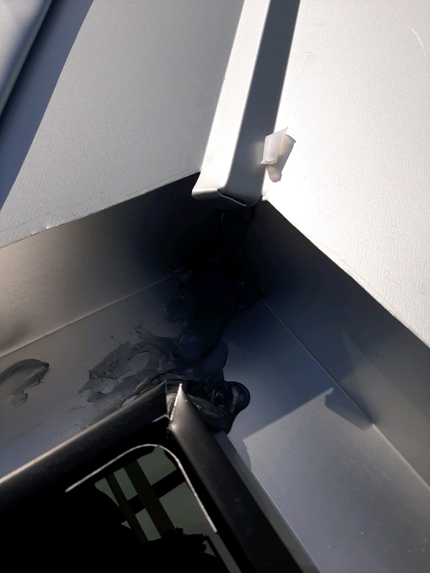 Seamless Gutter Installation Using Black Half Round Seamless Gutters by Gutter Professors