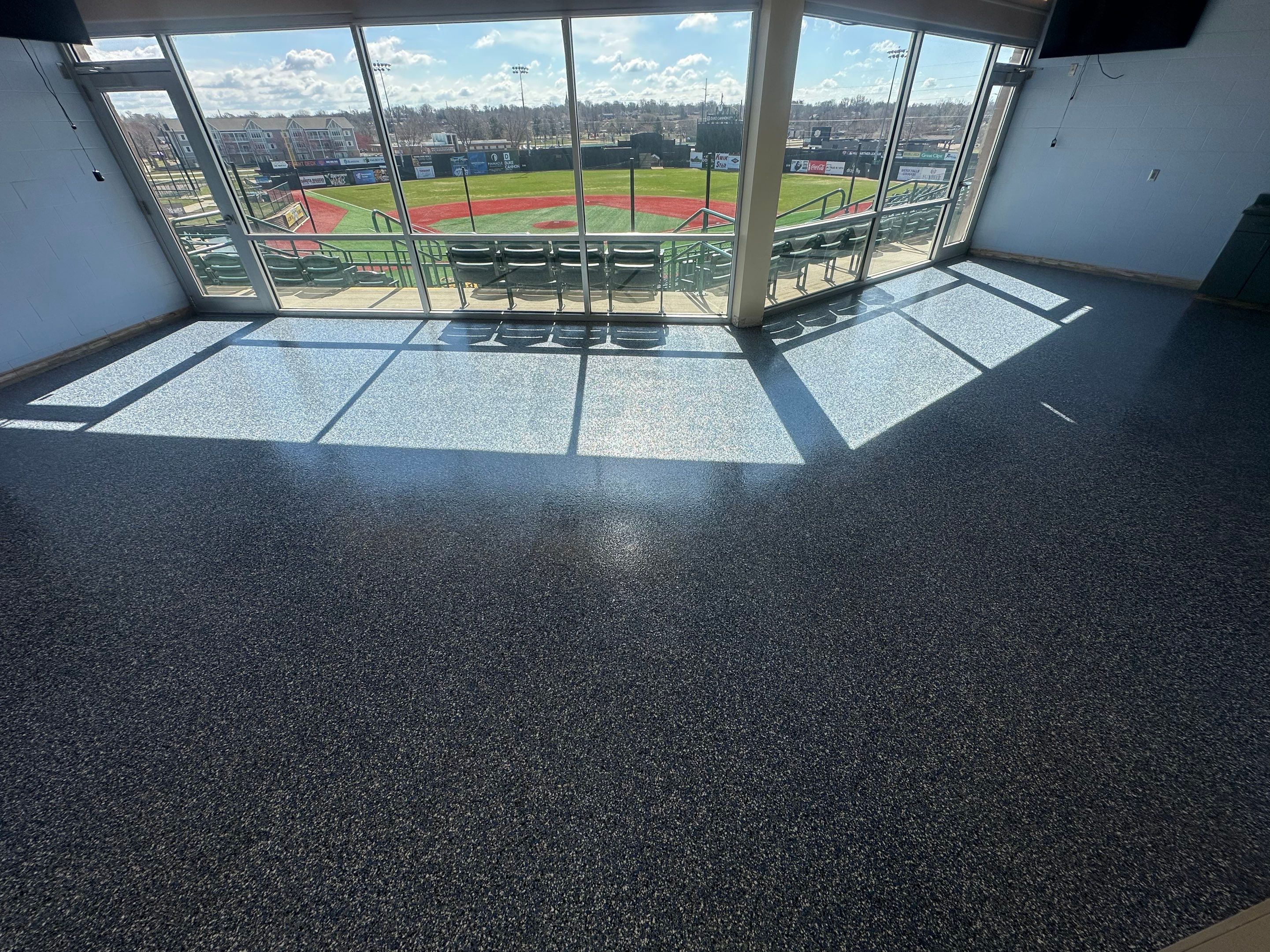 Commercial Epoxy Floor Coating for Stadium Viewing Suites in Sioux Falls by Select Painting, Coatings & Garage Cabinets