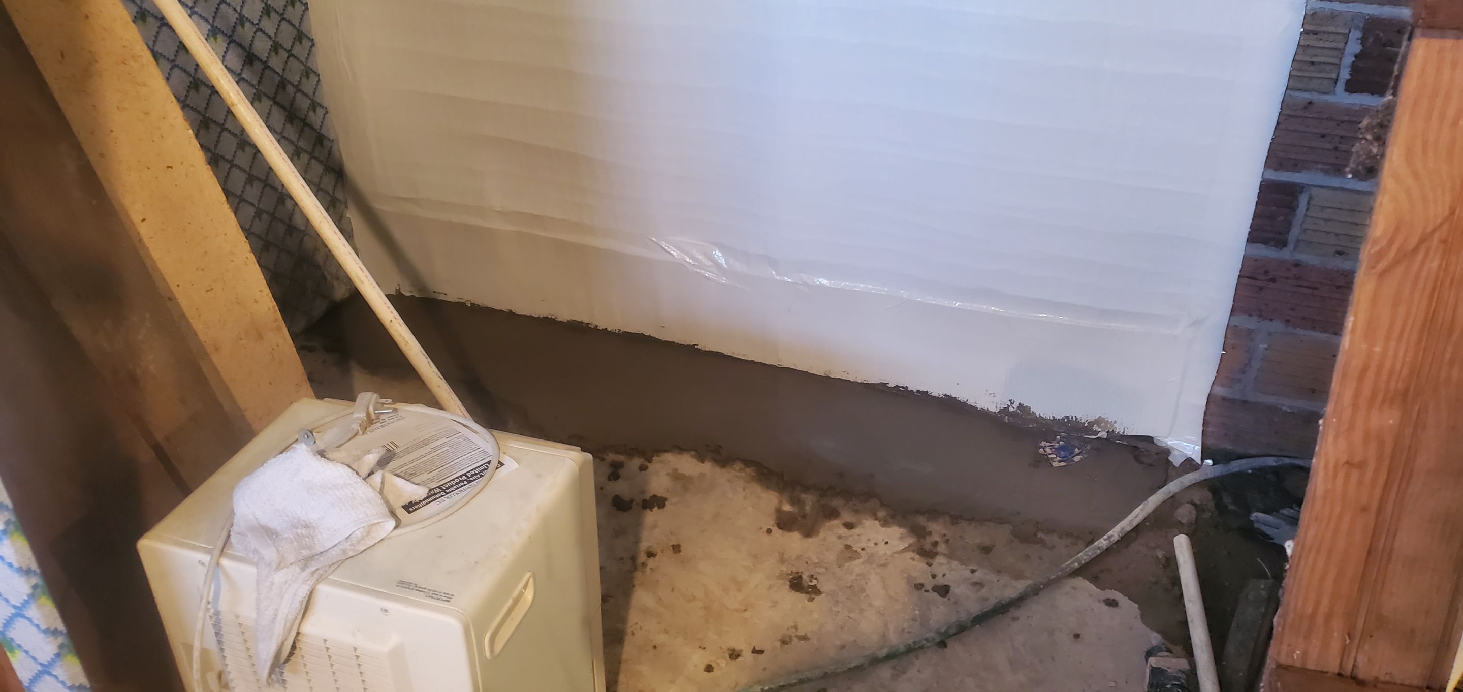 Interior Basement Waterproofing System using GrateDrain Waterproofing System by Toledo Basement Repair 