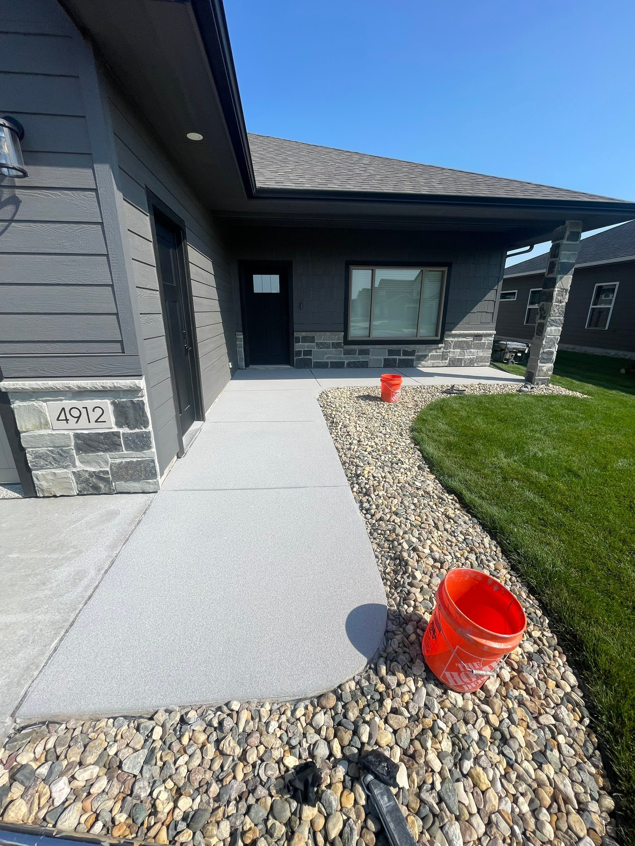 Sioux Falls Residential Concrete Patio and Walkway Coating by Select Painting, Coatings & Garage Cabinets