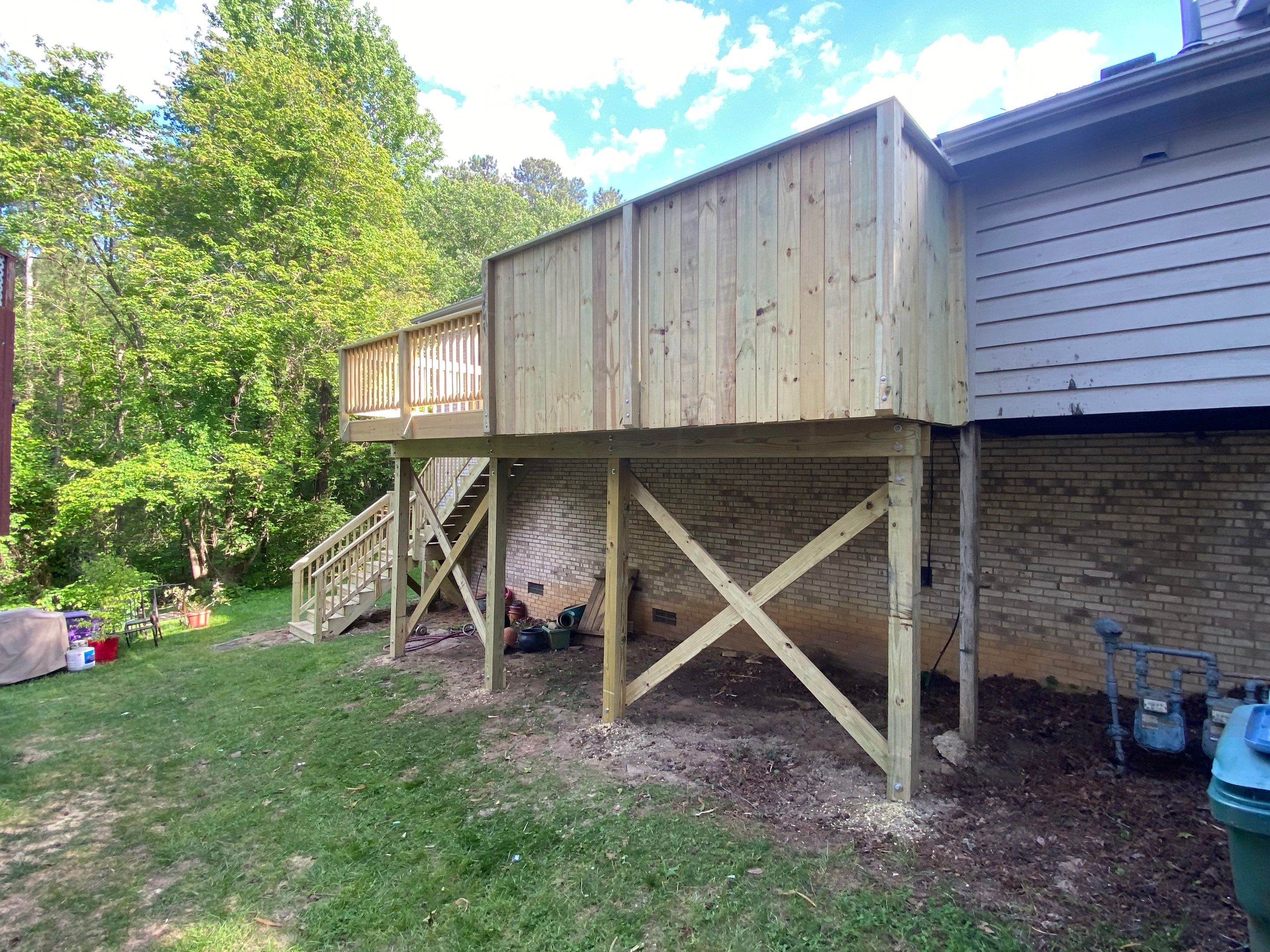 Pressure-Treated Deck Resurfacing and Custom Privacy Railing in Durham by The Remodeling Company