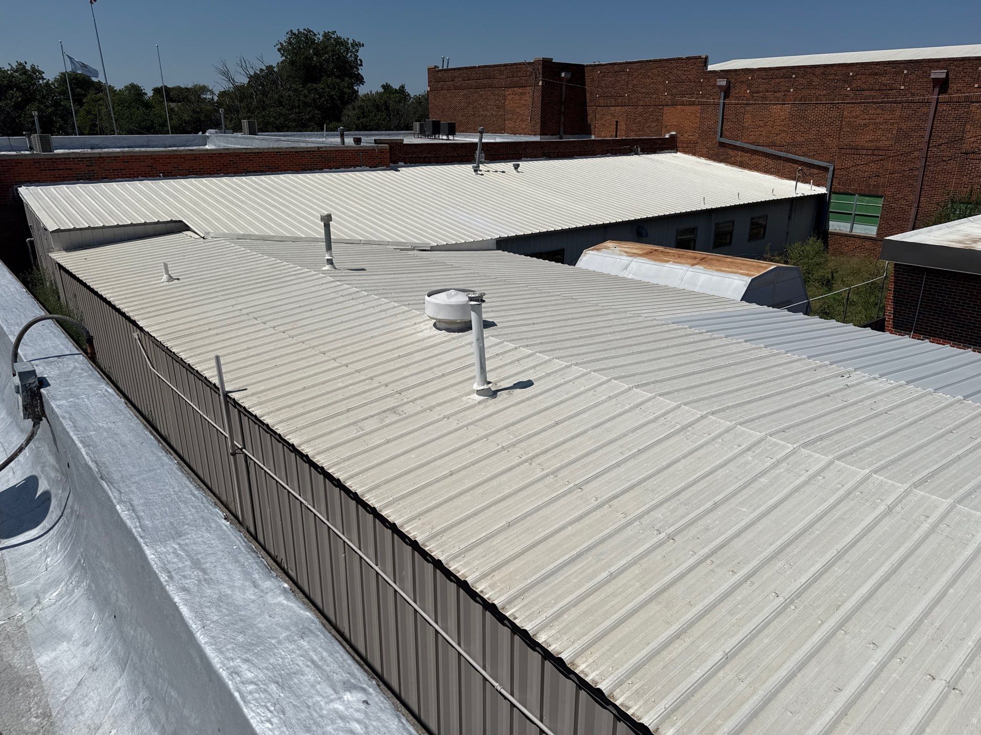 Hollis High School Comprehensive TPO Roof Replacement and Restoration by Secondary Rhodes