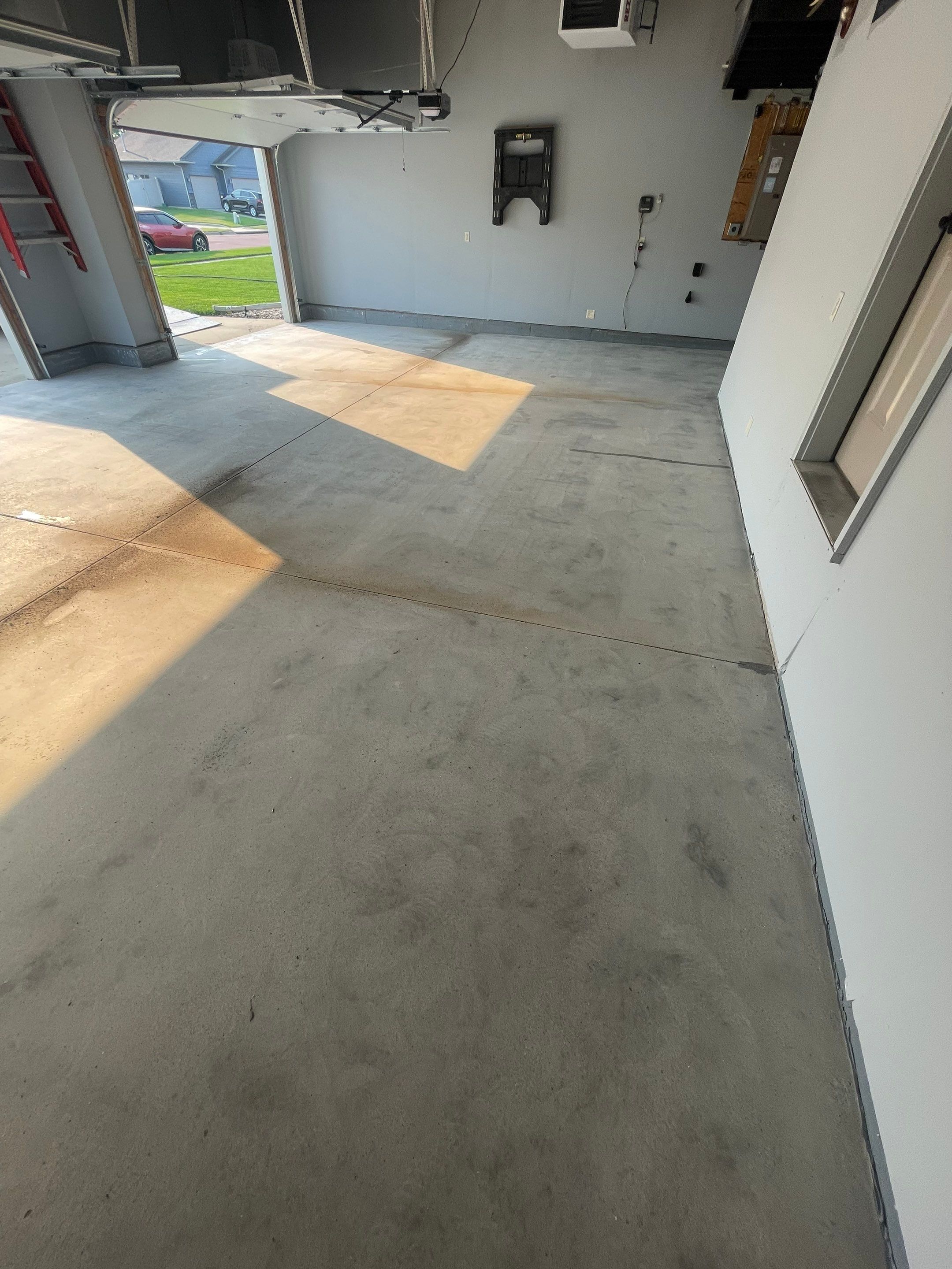 Sioux Falls Garage Concrete Coating Installation with Domino Flake by Select Painting, Coatings & Garage Cabinets