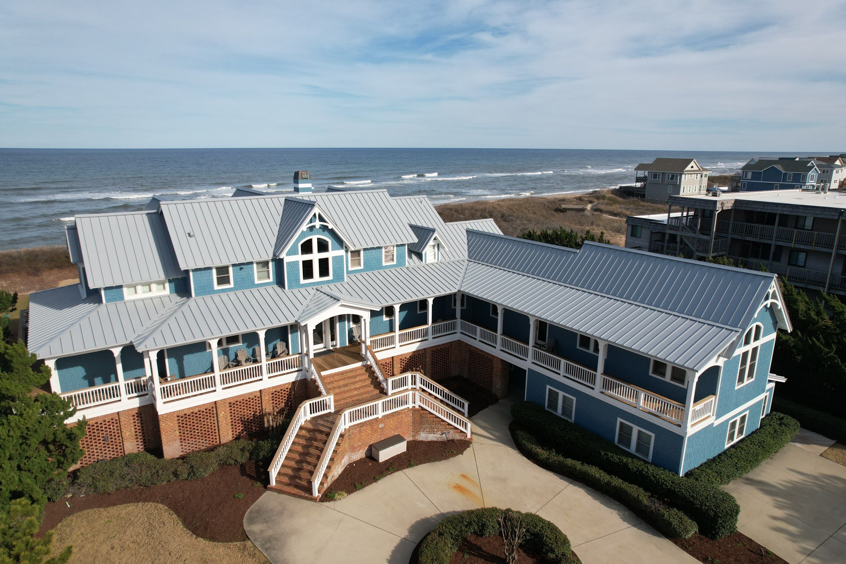 Large Metal Roof Transformation by Gallop Roofing & Remodeling, Inc.