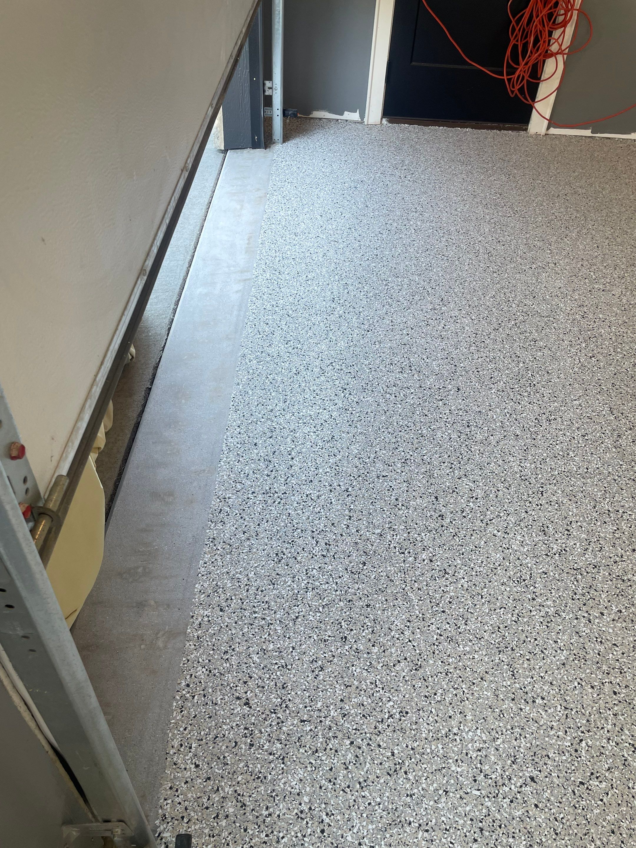 Custom Speckled Concrete Coating for Dell Rapids Garage by Select Painting, Coatings & Garage Cabinets