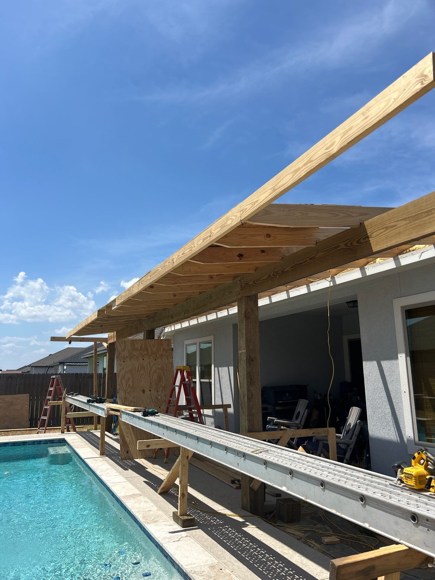 Patio Pool Cover by Bayfront Roofing and Construction