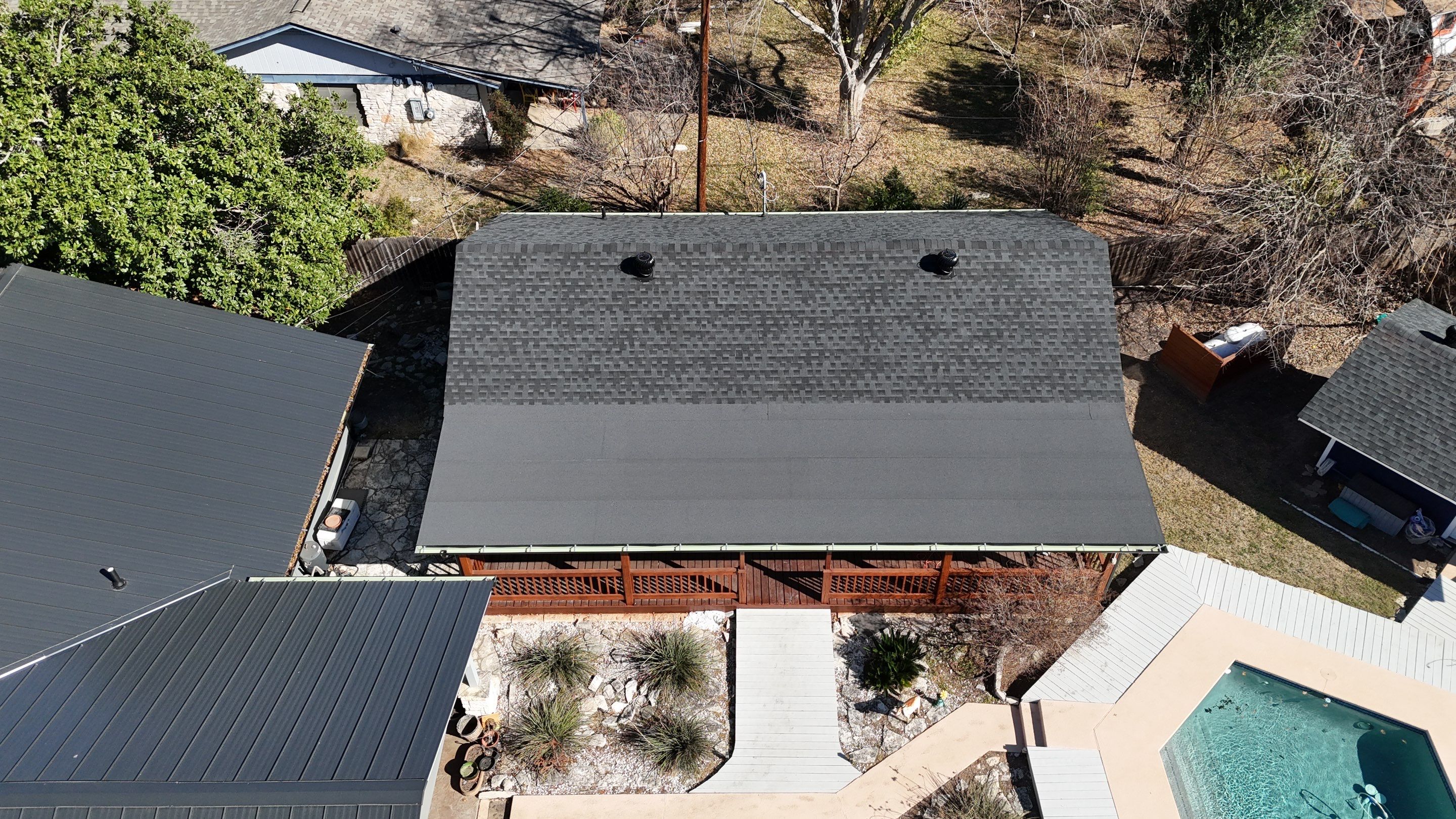 Residential Roof Replacement using Matte Black 24g by Action Exteriors Austin