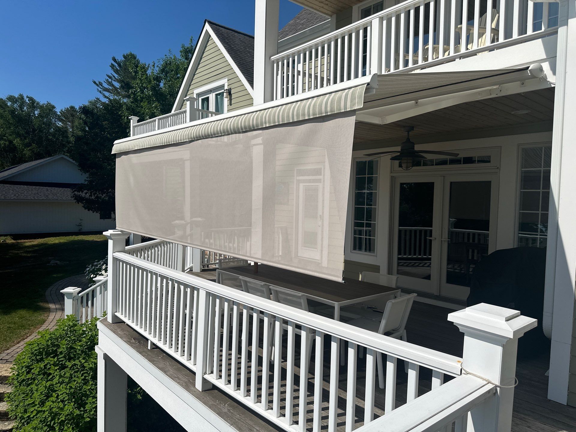 Sunesta Retractable Awning Installation for Lakeside Deck in Kewadin by Rainbow Seamless Systems