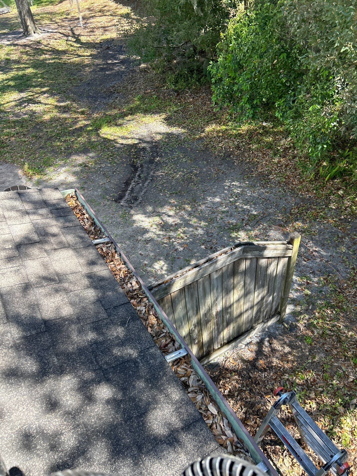 Commercial gutter cleaning The Villages, FL before photo with filled gutters