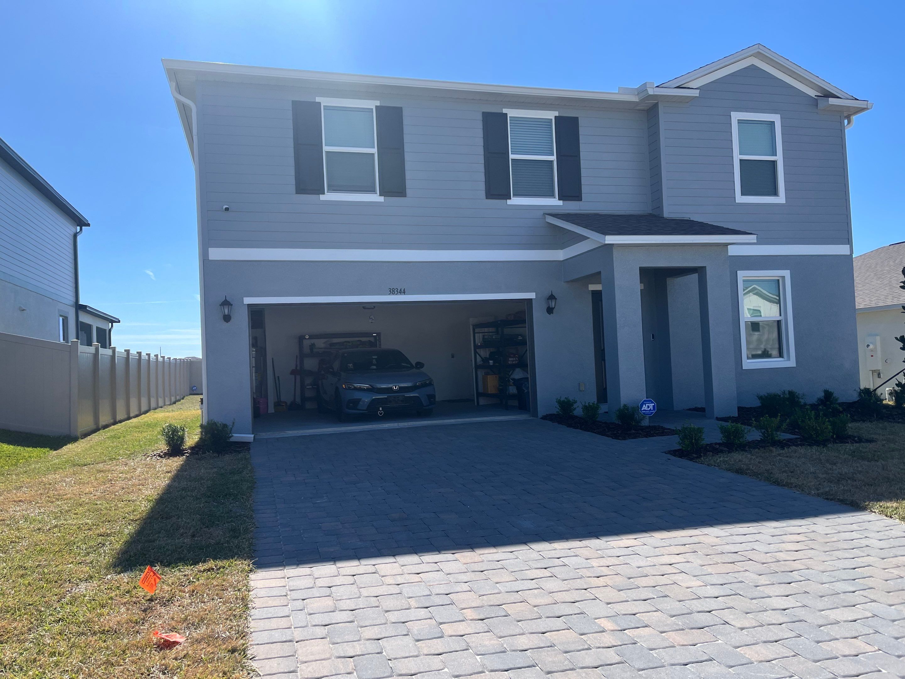 White Down Spouts and Seamless Gutters using downspouts in Dade City FL by Gutter Professors