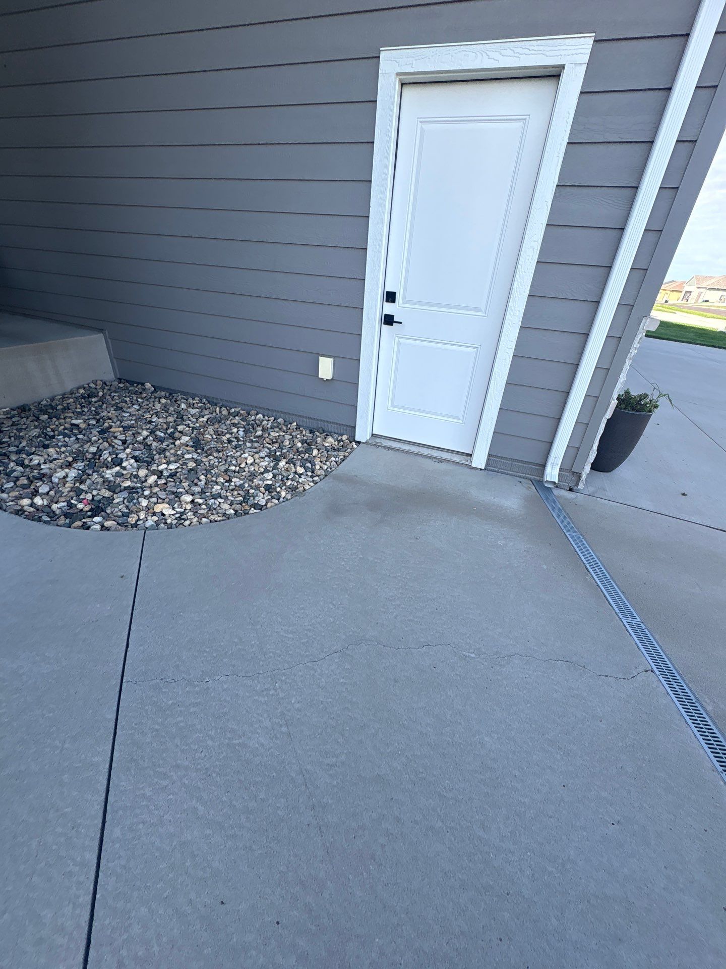 Gray Foundation Painting and Exterior Surface Refresh in Sioux Falls by Select Painting, Coatings & Garage Cabinets