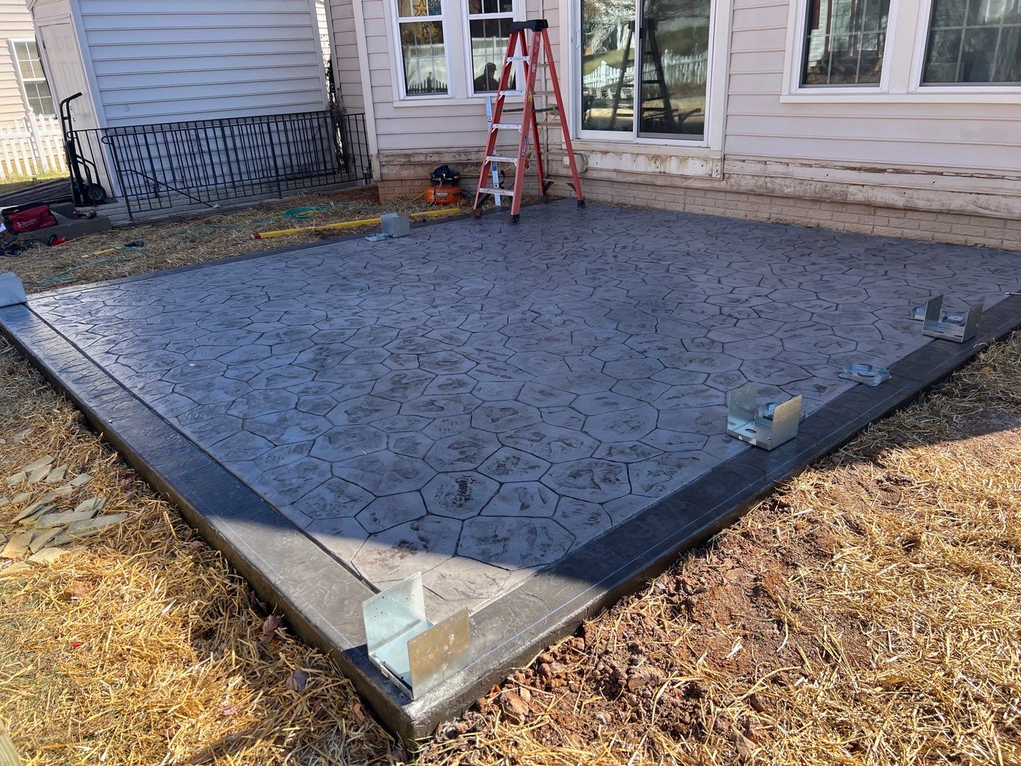 Custom Screened-In Porch with Stamped Concrete Patio in Warrenton by Jakari Restoration & Construction LLC