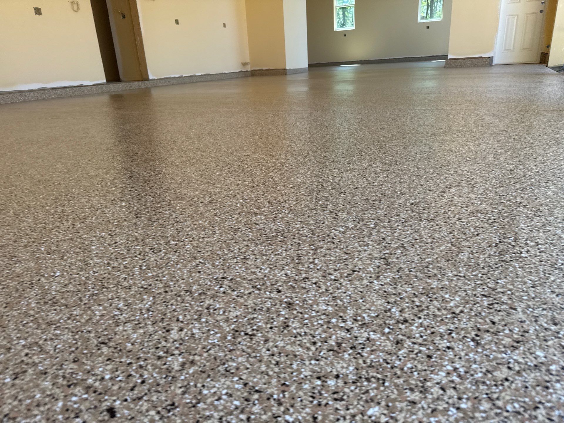Garage and interior Project in Gainesville, FL in Sandstone by Cross Creek Concrete Coatings