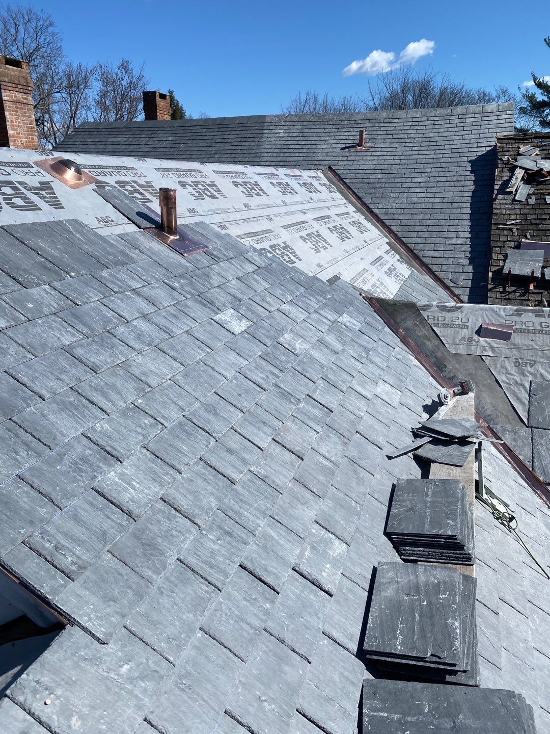 Residential Roofing Installation using Vermont Slate by A Plus Exterior
