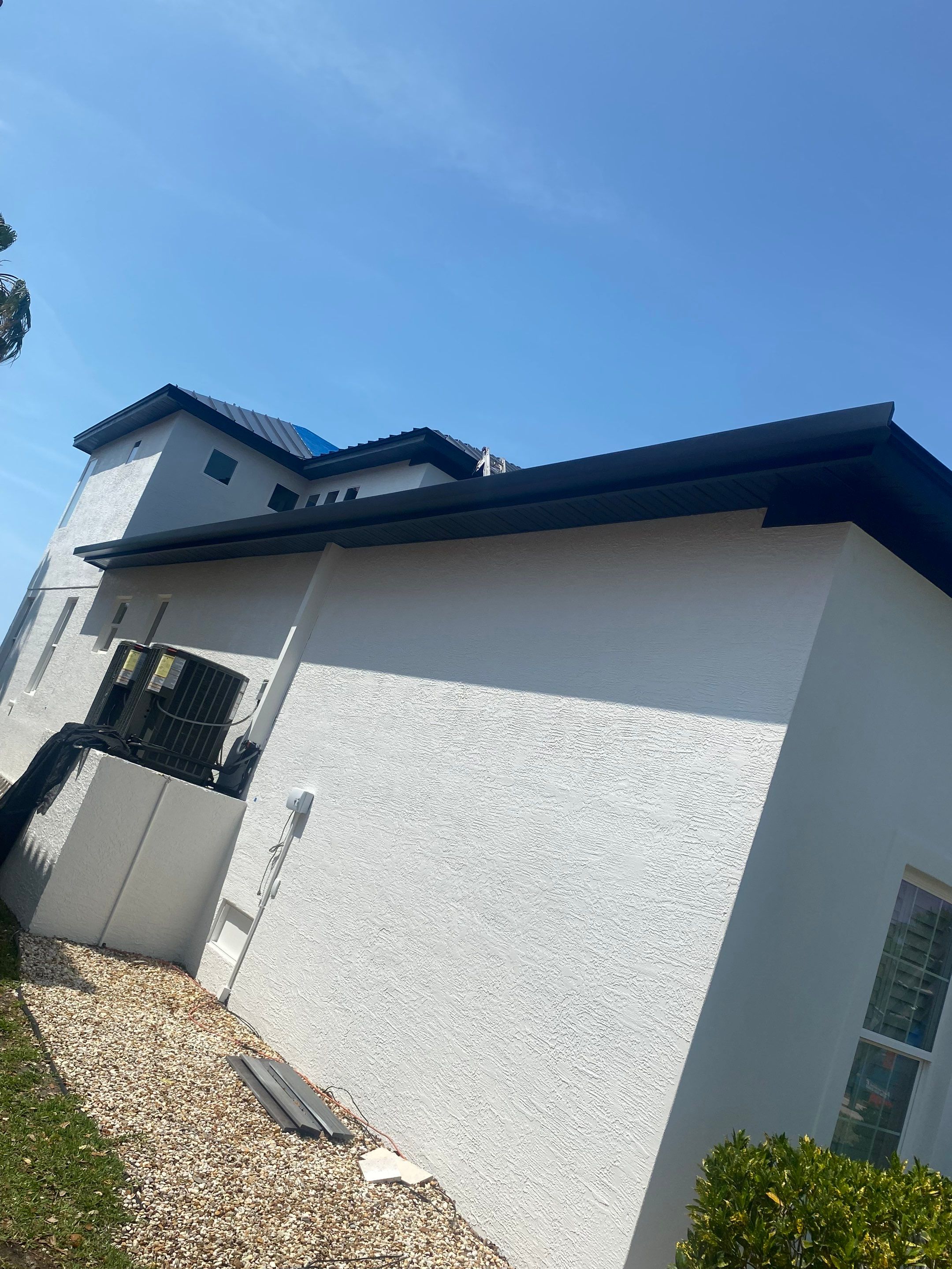 Soffit and Fascia Installation and black seamless gutters in Sarasota FL by Gutter Professors
