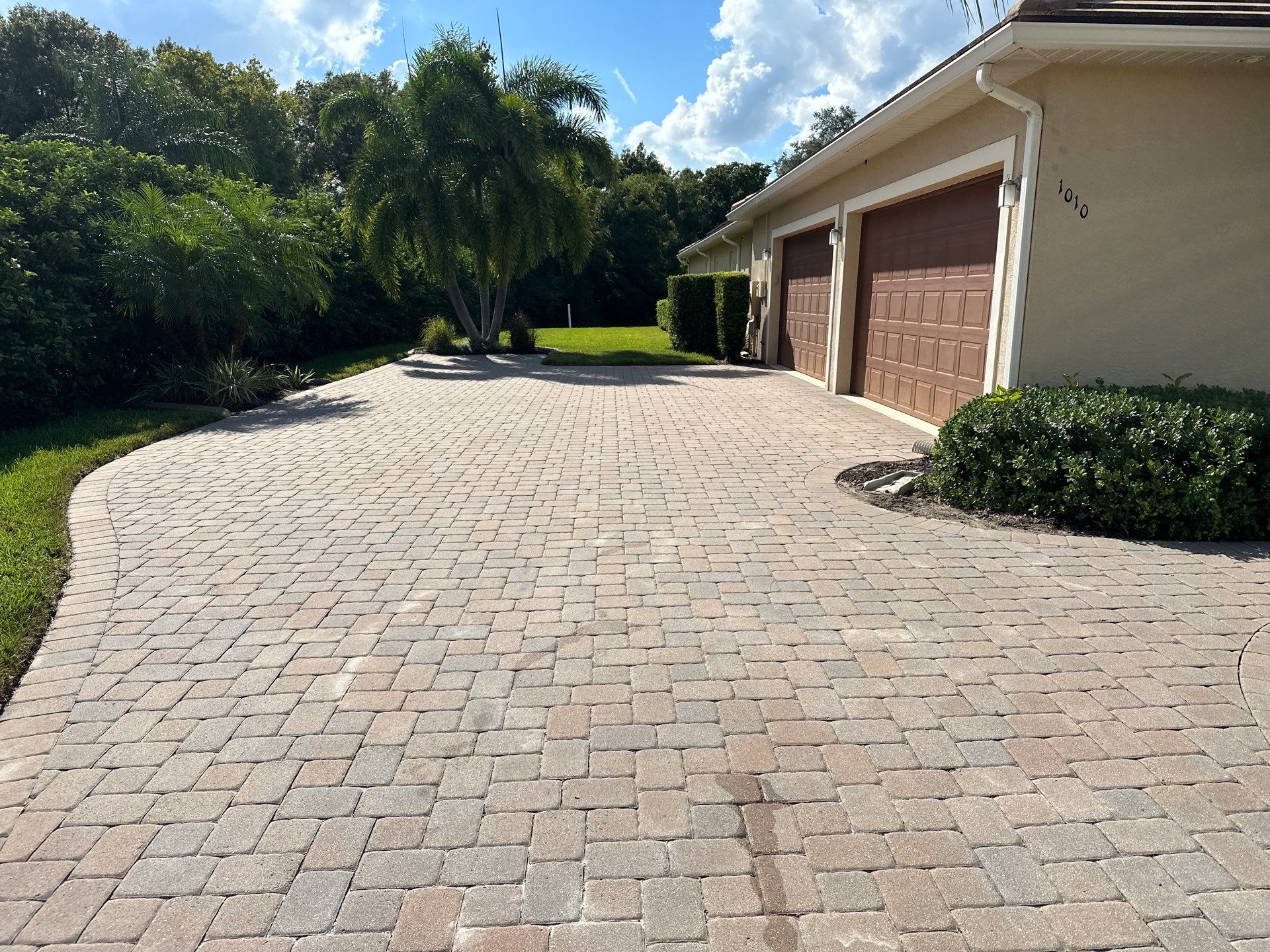 Paver Driveway, Entryway, Sidewalk, and Street Curbing Cleaning in Winding River Community, Bradenton, FL by Sunshine AquaWash