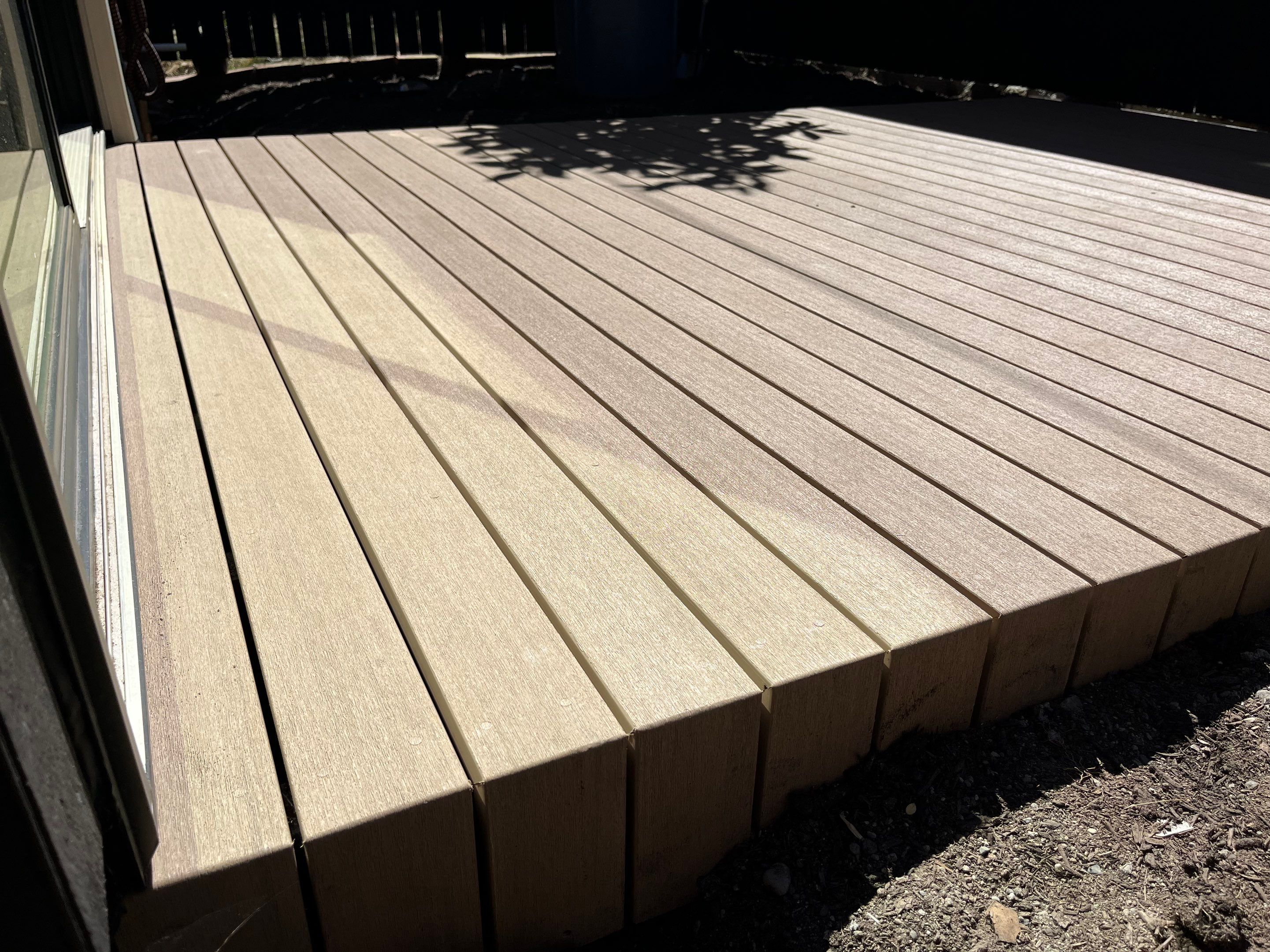 Modern Backyard Deck by Alki deck builders 